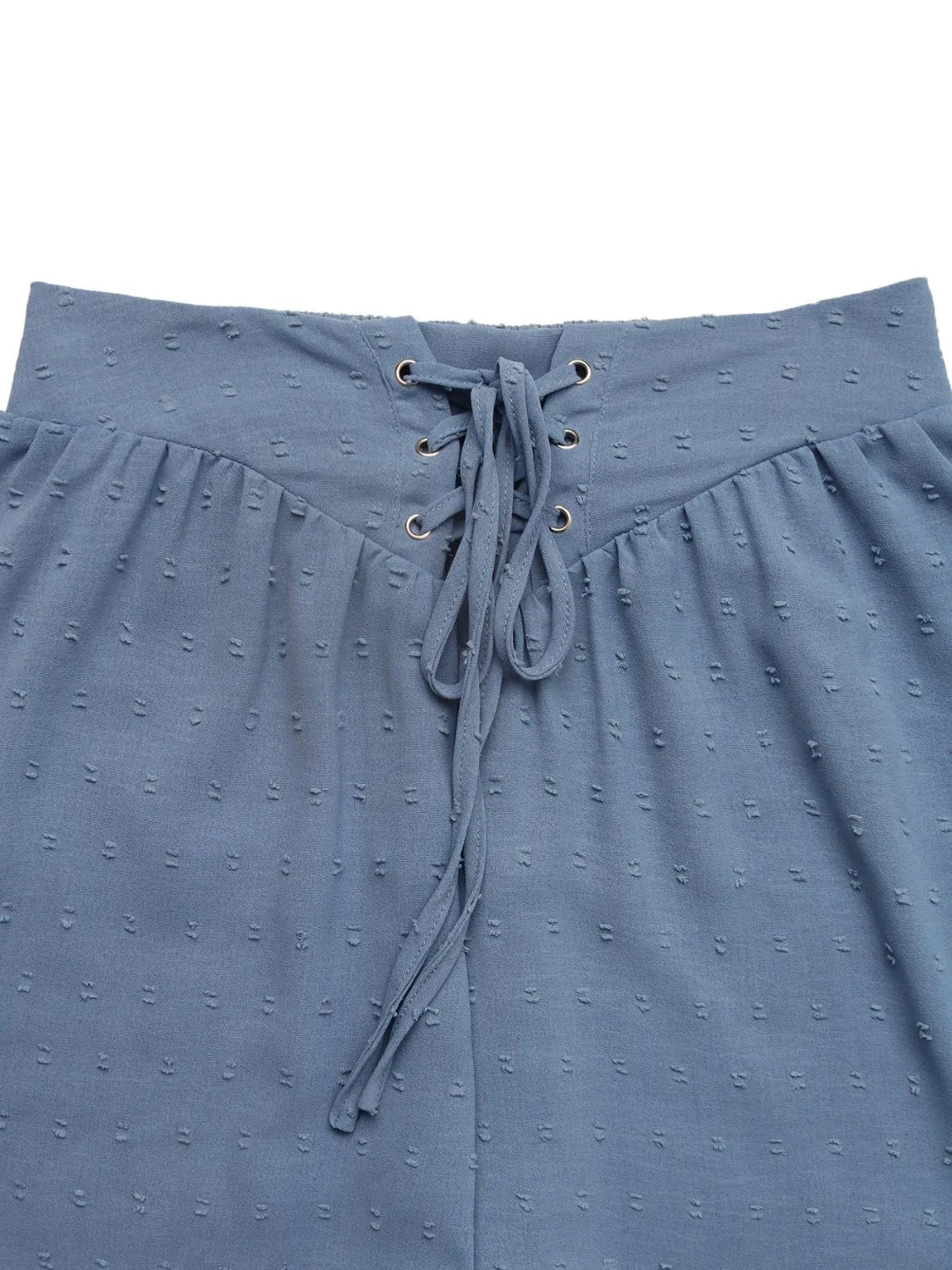 Swiss Dot Lace Up Shorts - Close-up view showcasing lace-up detail and soft texture.