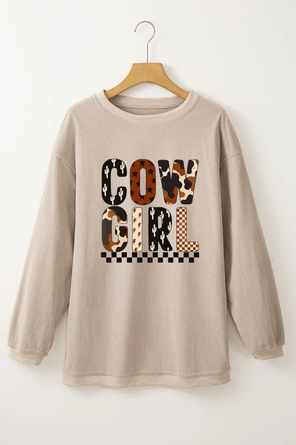Cowgirl Graphic Long Sleeve Sweatshirt featuring a stylish design with 'COW GIRL' text and a trendy cactus pattern on a comfortable, slightly stretchy 100% polyester fabric.
