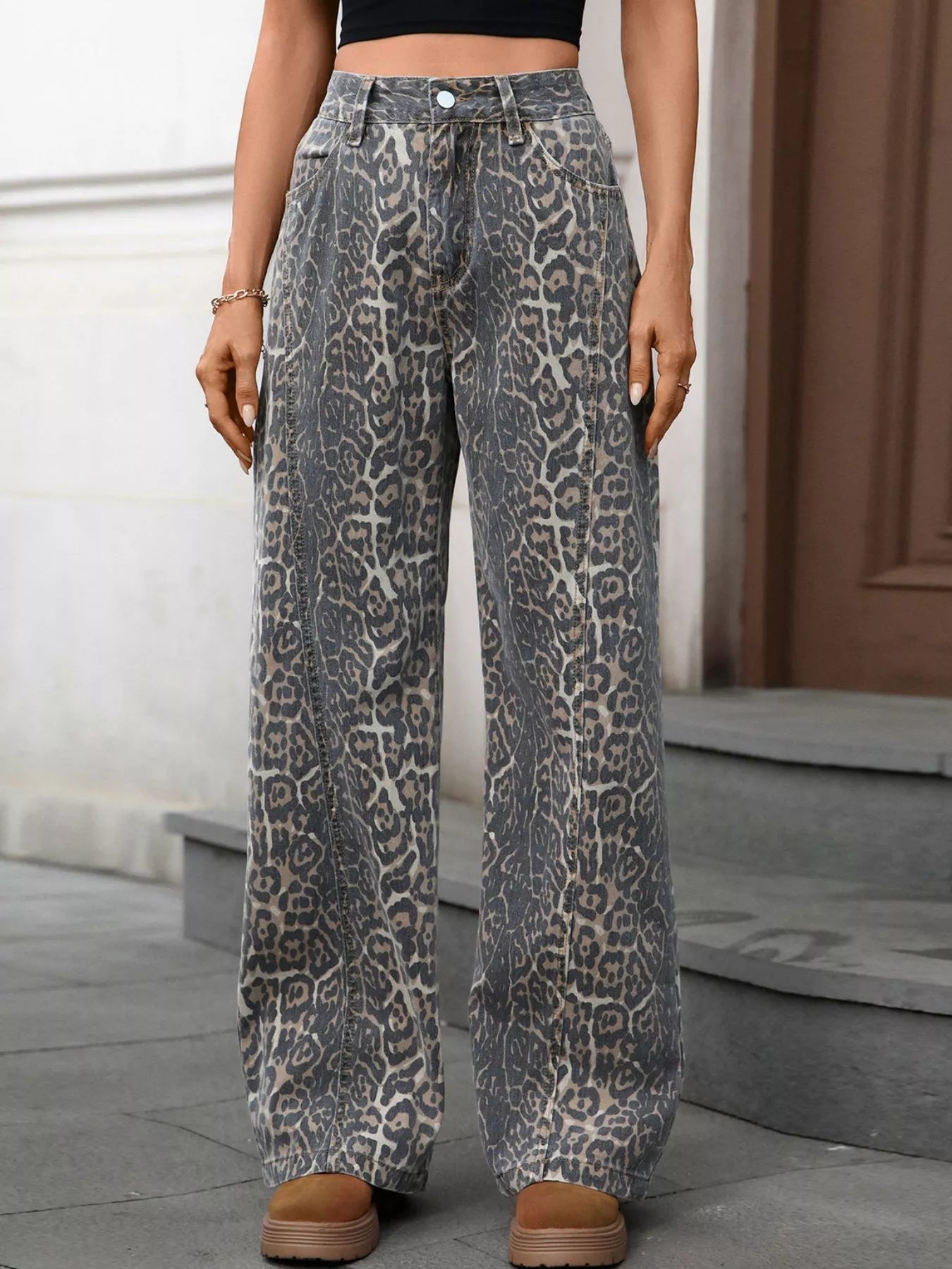 Model wearing Leopard Wide Leg High Waist Jeans in a stylish outdoor setting with a trendy design.