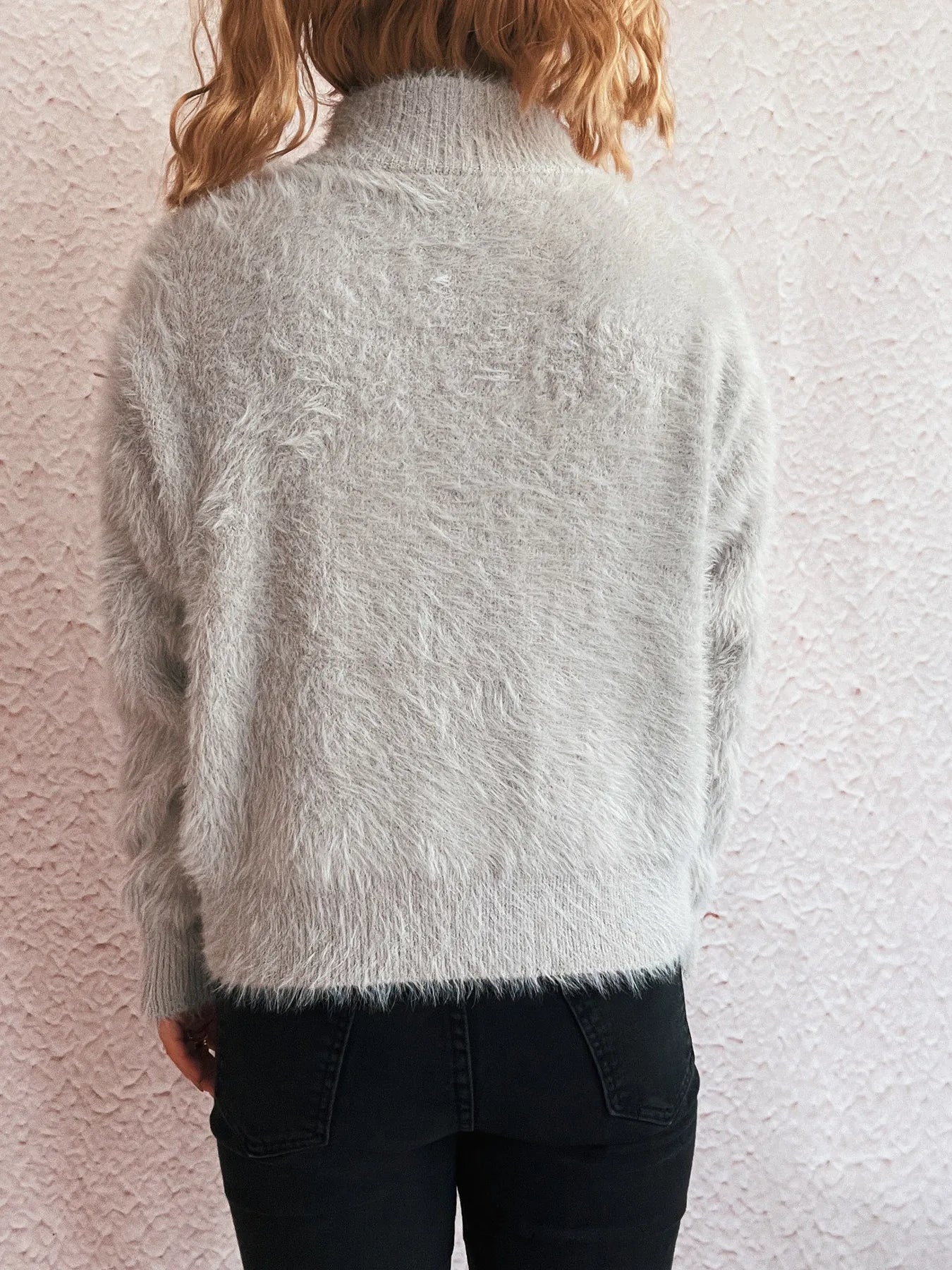 Back view of the Cozy Fuzzy Half-Zip Sweater for Women, made of 100% stretchy polyester, showcasing its soft texture and stylish design.