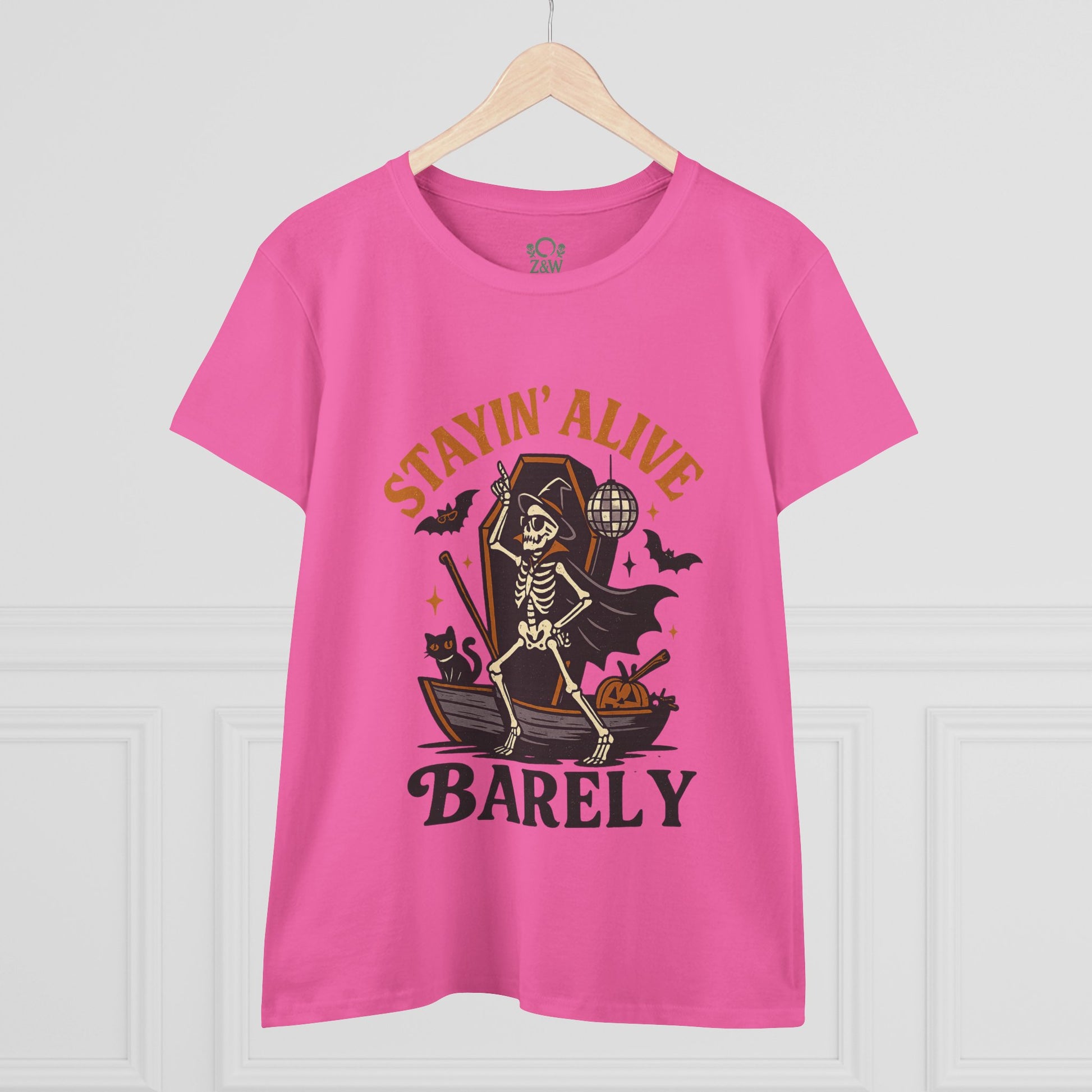 Front view of the Stayin’ Alive T-Shirt with a skeleton graphic, designed for fun Halloween occasions, presented in a bright pink color.