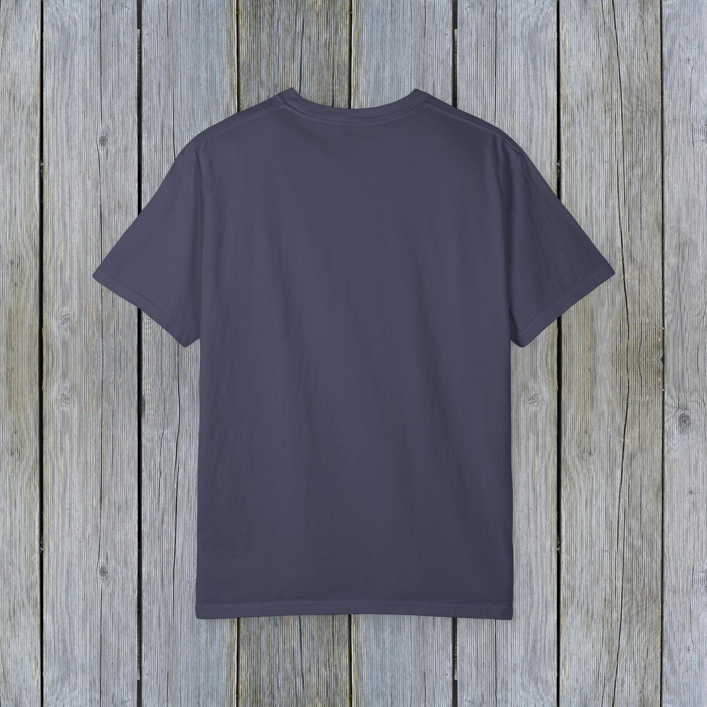 Back view of the Unisex Garment-Dyed Lake Rules Tee - Soft Vintage Fabric, Sizes S to 4XL, ideal for outdoor adventures, displayed against a weathered wooden texture.