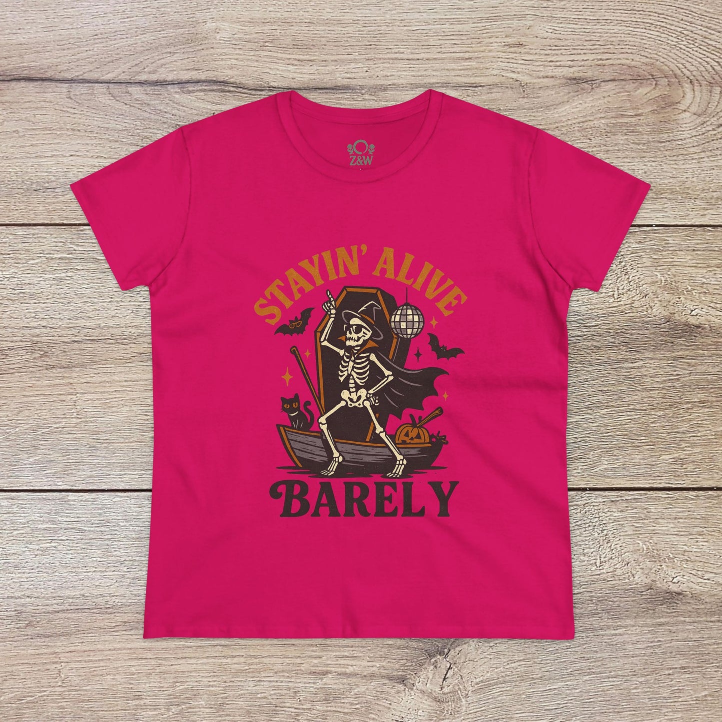 Vibrant pink Stayin’ Alive T-Shirt showcasing a playful skeleton illustration, ideal for fun Halloween celebrations.