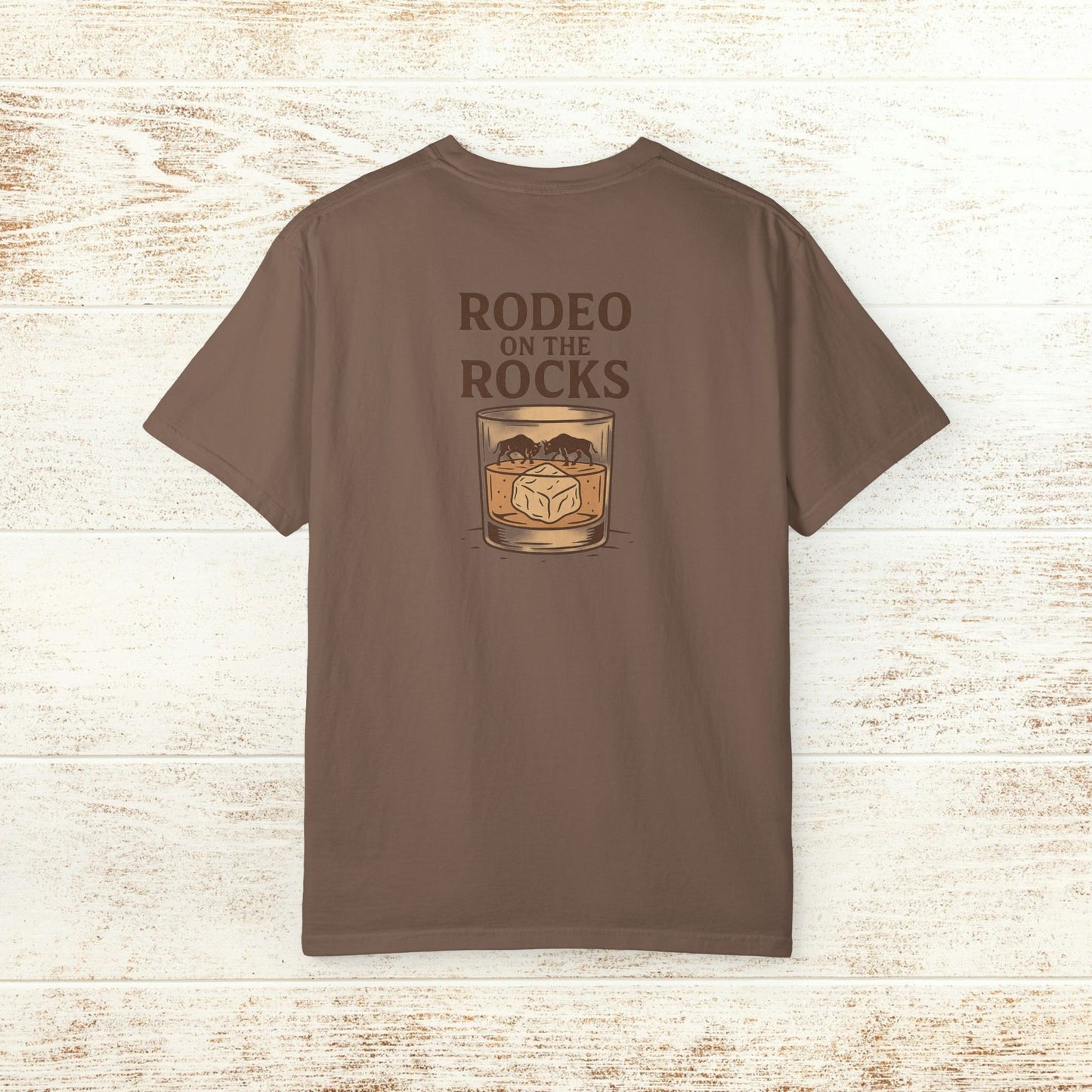 Back view of the Rodeo On The Rocks Tee in brown, featuring a stylish design with a glass and mountains graphic, made from soft 100% US cotton, sizes S-4XL.