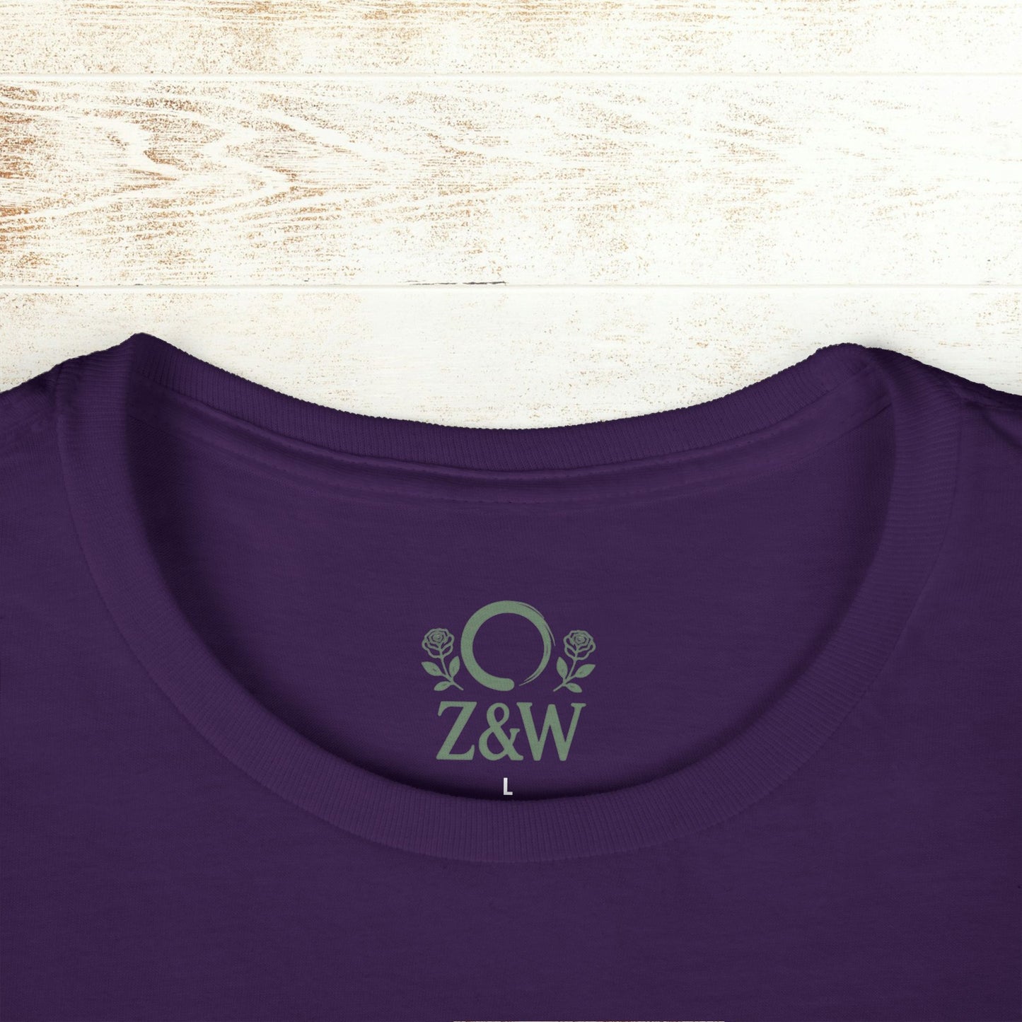 Detailed view of the collar on the No Bad Vibes Tee with Z&W logo in a vibrant purple shade, made from sustainable cotton.
