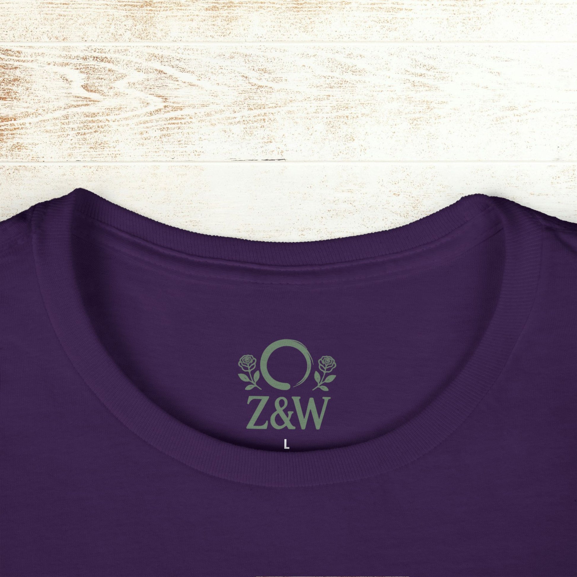 Detailed view of the collar on the No Bad Vibes Tee with Z&W logo in a vibrant purple shade, made from sustainable cotton.