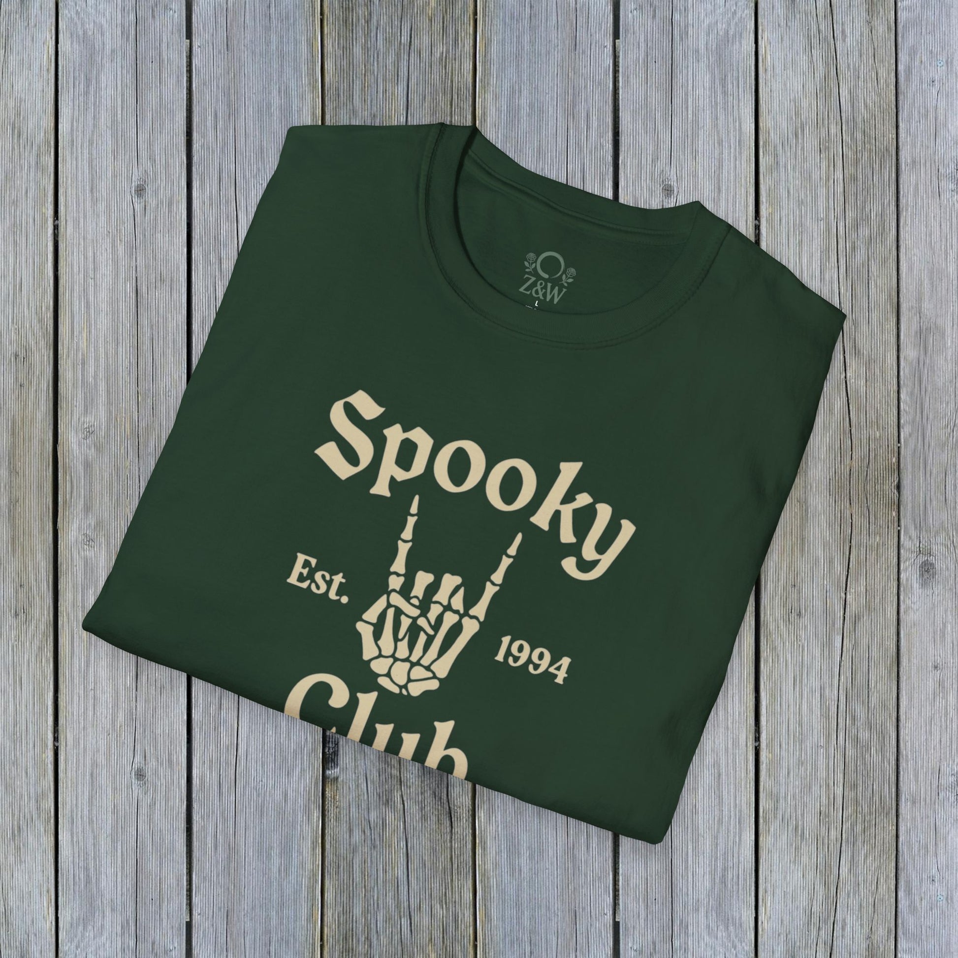 Unisex Spooky Club Tee in green, featuring a bold skeleton hand design and 'Spooky Club Est. 1994' lettering, crafted from soft and durable 100% cotton.
