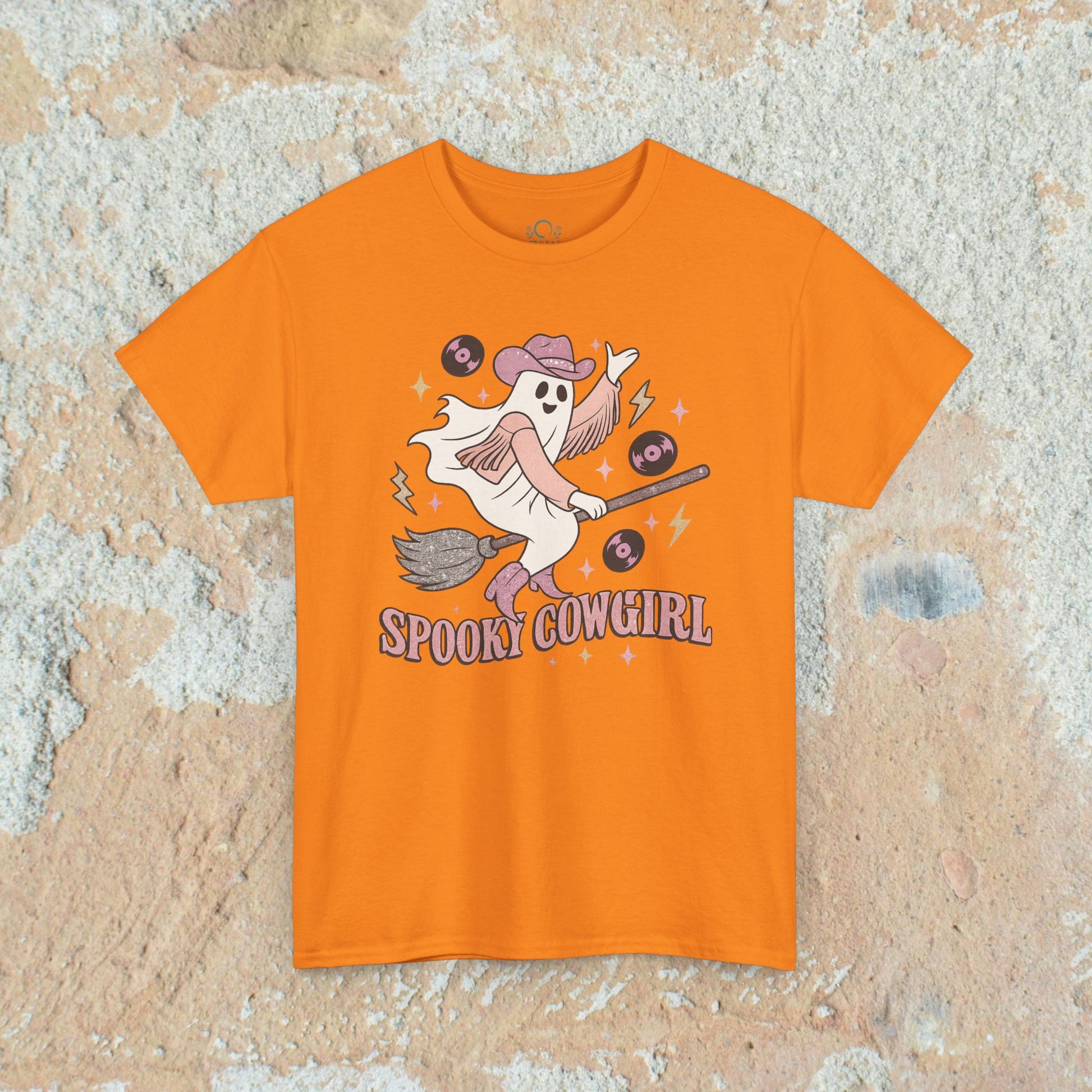 Spooky Cowgirl Graphic Tee in vibrant orange, highlighting a cheerful ghost with a cowboy hat, making it a fun choice for Halloween and casual wear.