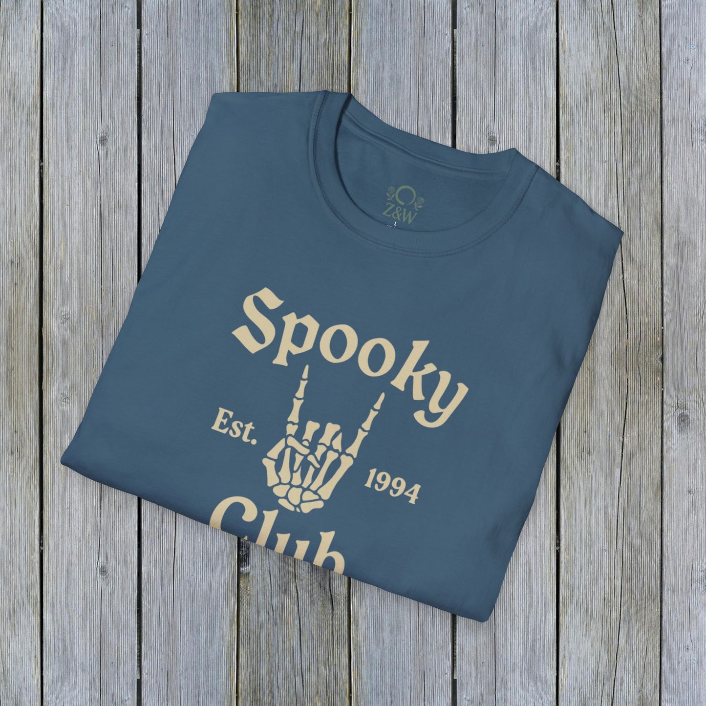 Unisex Spooky Club Tee in blue, showcasing a skeleton hand graphic and 'Spooky Club Est. 1994' text, made of 100% soft and durable cotton.