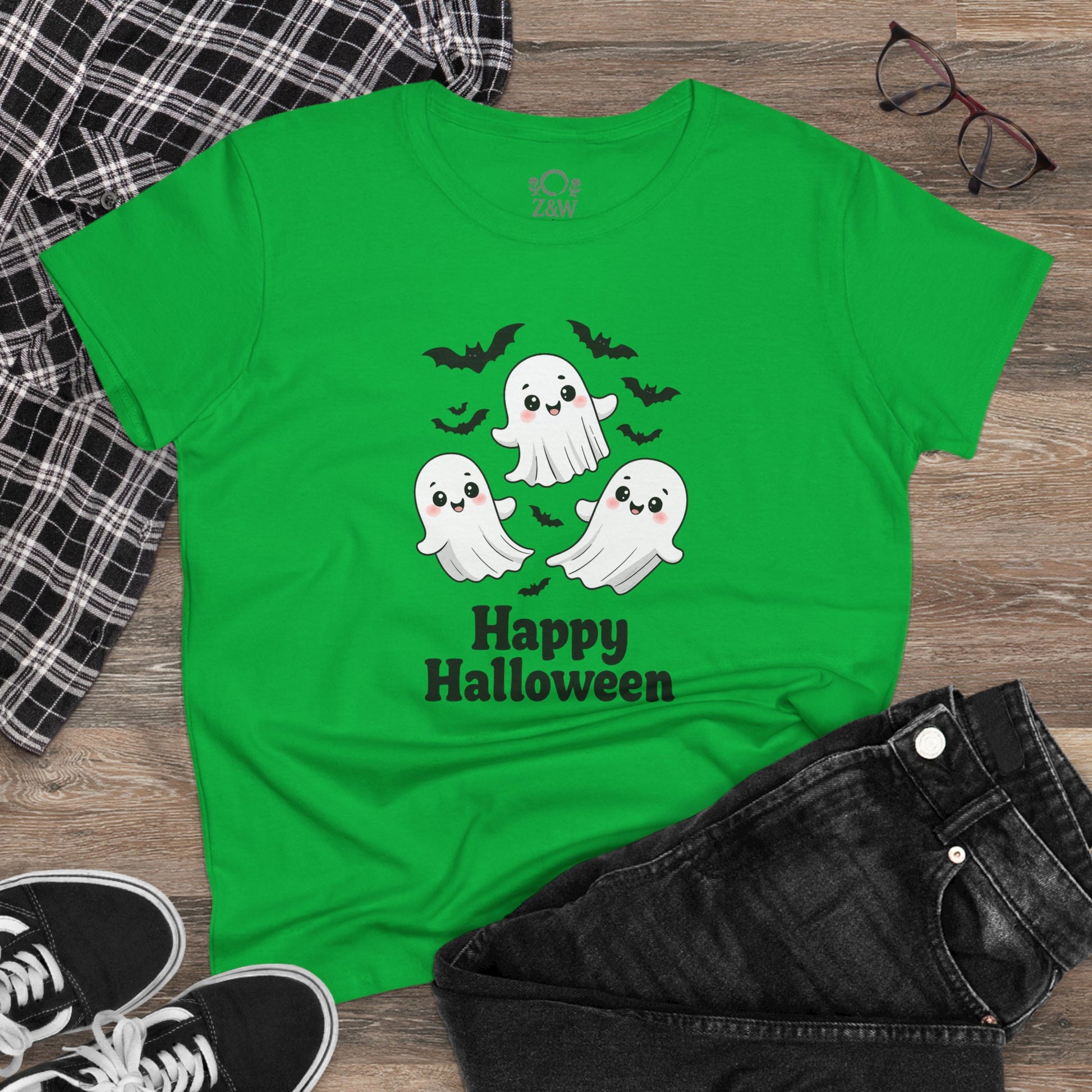 Flat lay of a Cute Halloween Ghost T-Shirt for Kids & Adults, Unisex Spooky Tee, Soft Cotton Halloween Apparel in green, paired with black jeans and stylish sneakers.