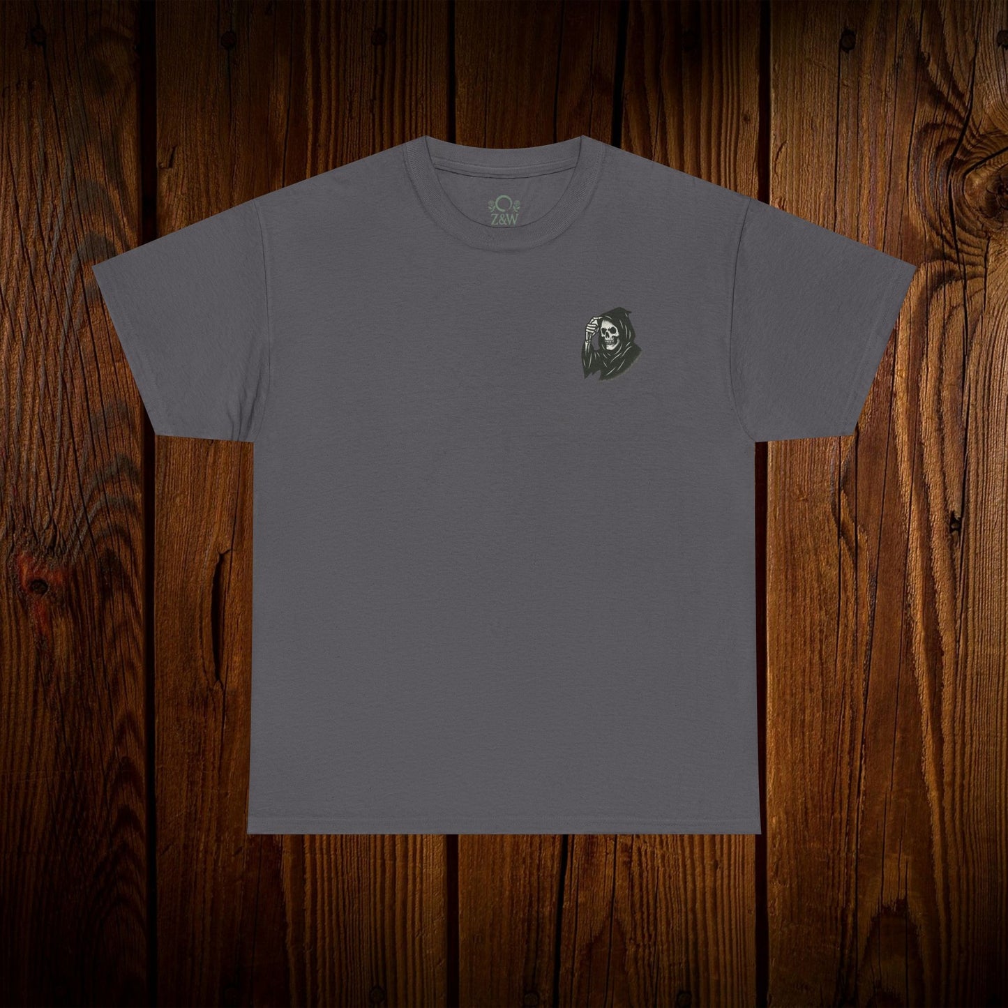 Spooky Halloween Graphic Tee displayed on a wooden background, highlighting the front of the unisex cotton shirt with a ghost design, ideal for Halloween festivities.