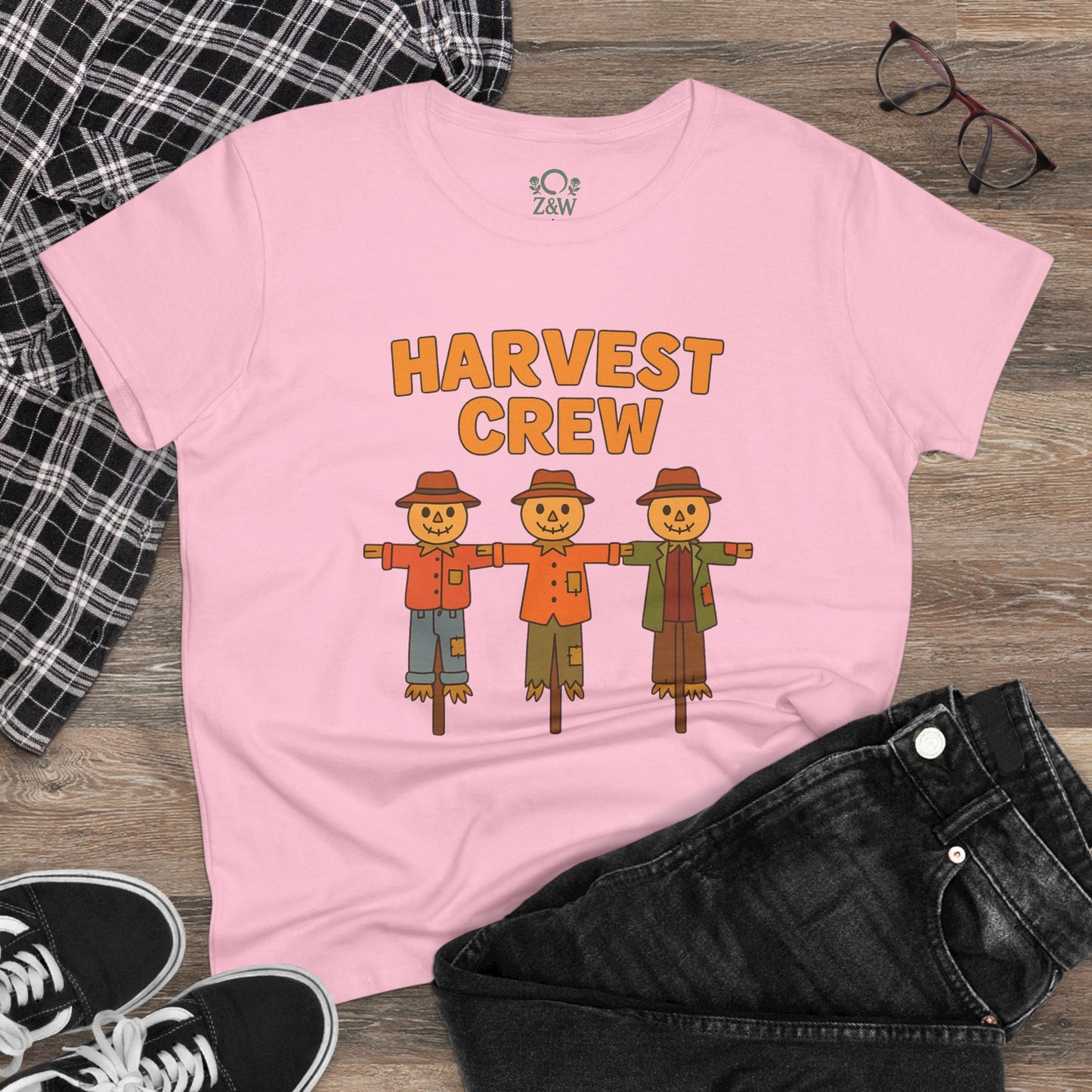 Harvest Crew Halloween T-Shirt in pink featuring cute scarecrow graphics, made from 100% ring-spun cotton, perfect for festive fall celebrations.