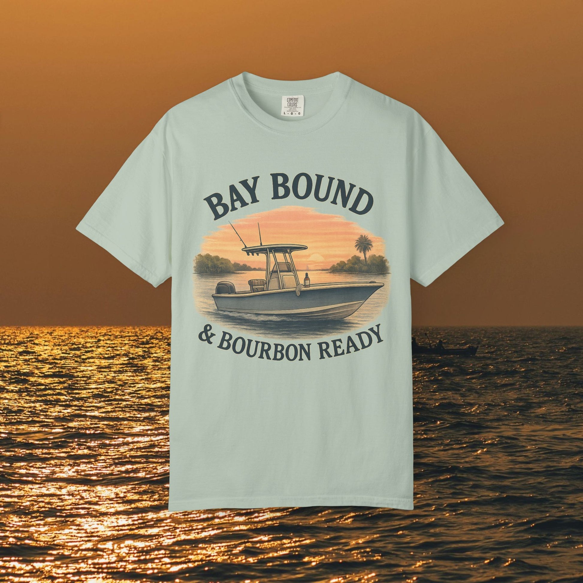 Bay Bound T-Shirt for Summer featuring a boat graphic against a sunset backdrop, perfect casual tee for fishing and beach lovers.