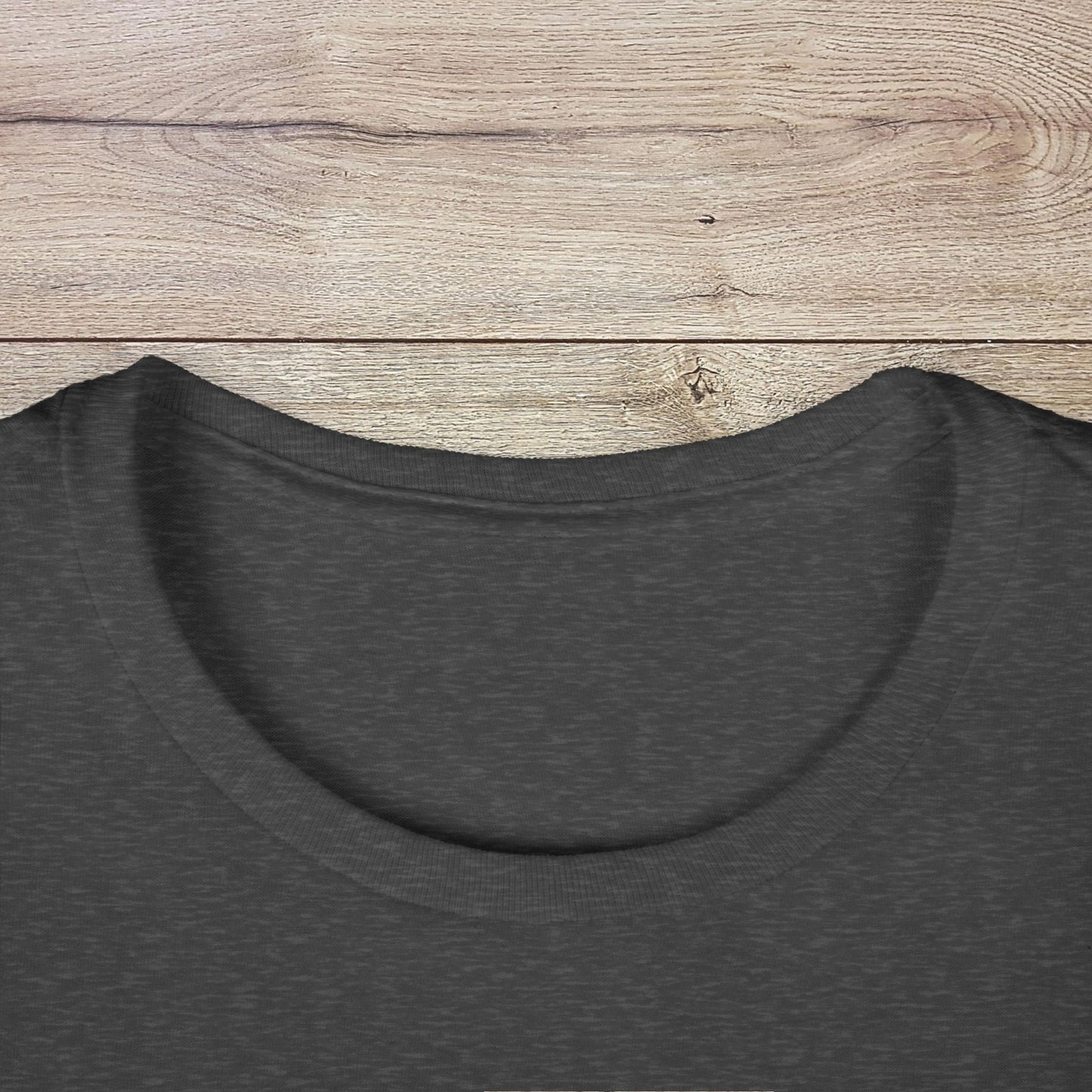 Close-up of the neckline on the dark gray Golf Wives Social Club Tee, highlighting its elastic ribbed knit collar.
