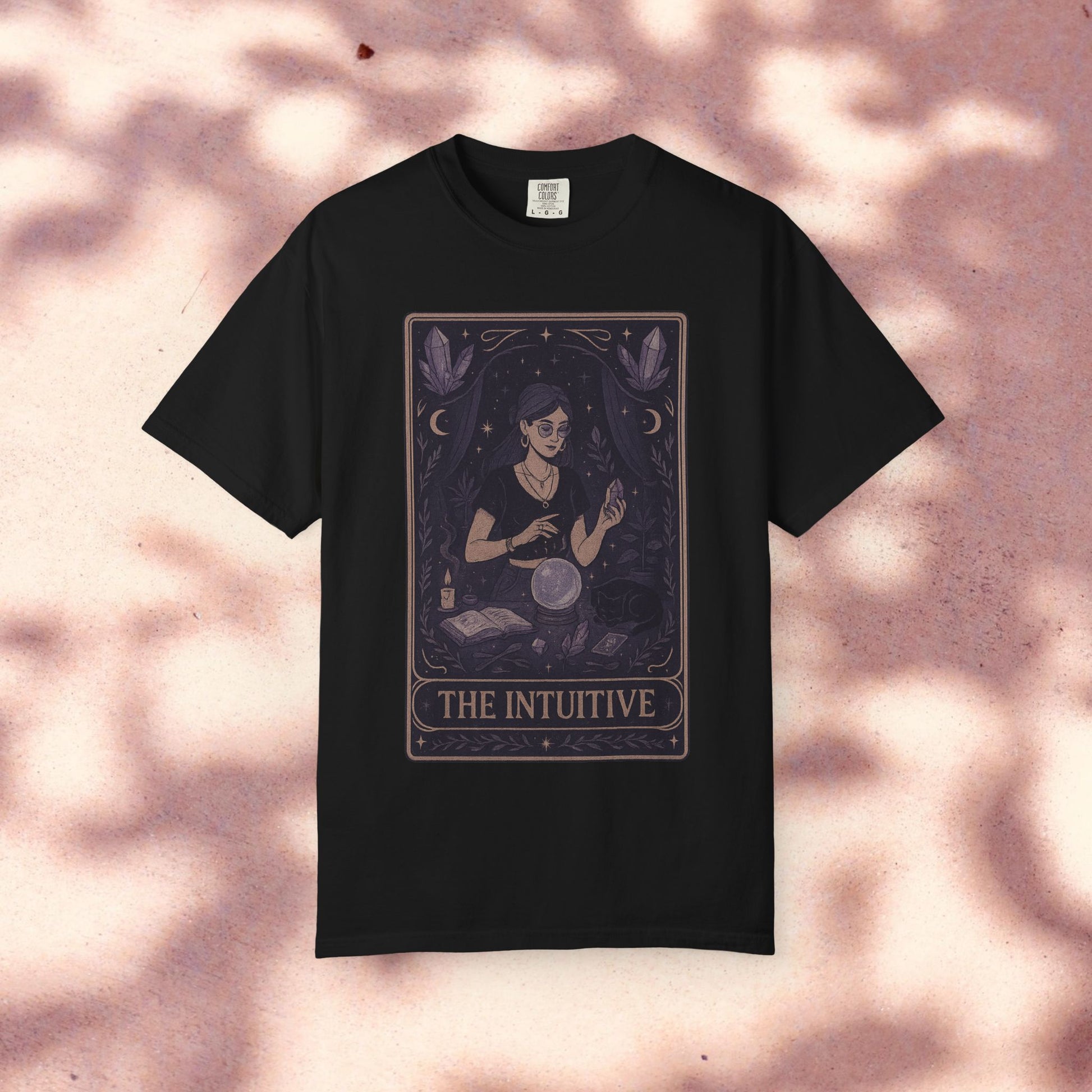 Intuitive Tarot Tee featuring a mystical design of a woman reading tarot cards, made from premium 100% cotton, perfect for spiritual enthusiasts.