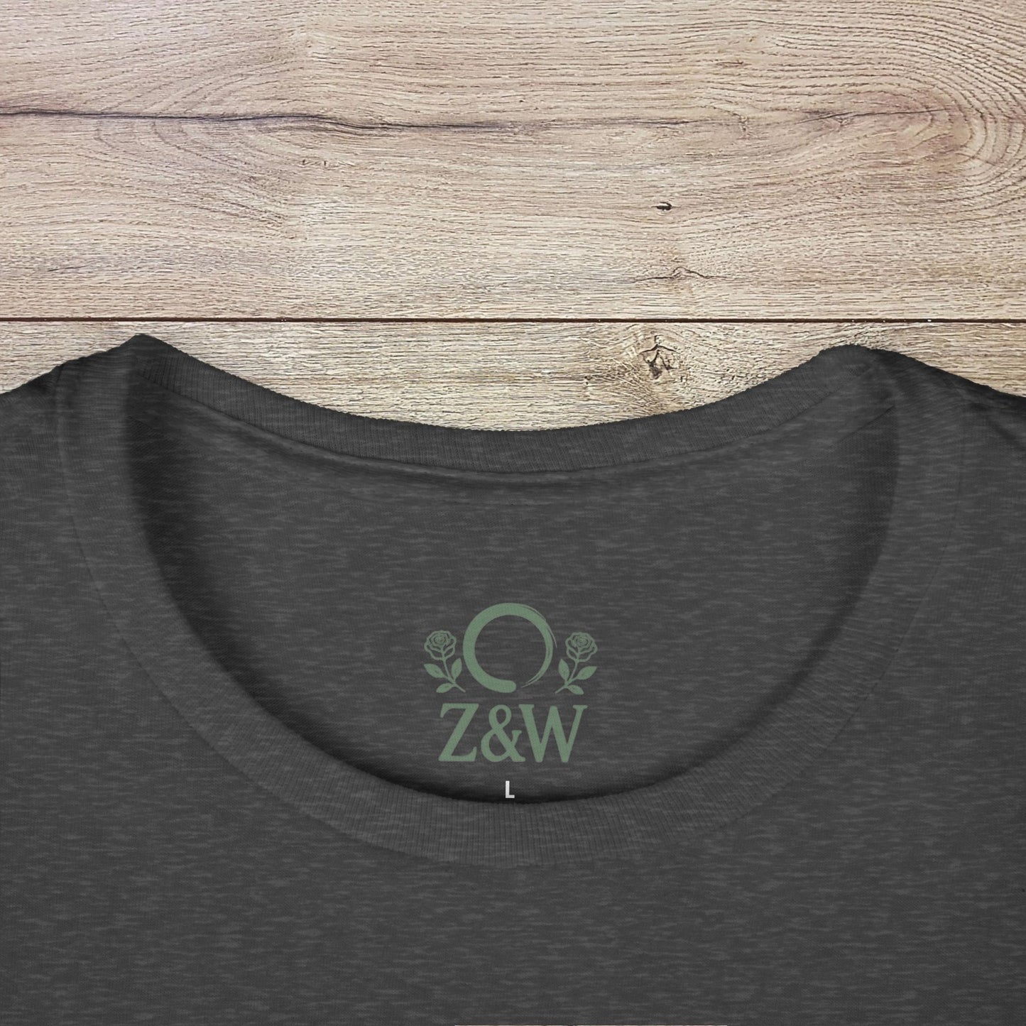 Close-up of the collar area of a Funny Pilates T-Shirt in dark gray, displaying the Z&W logo and smooth fabric ideal for printing.