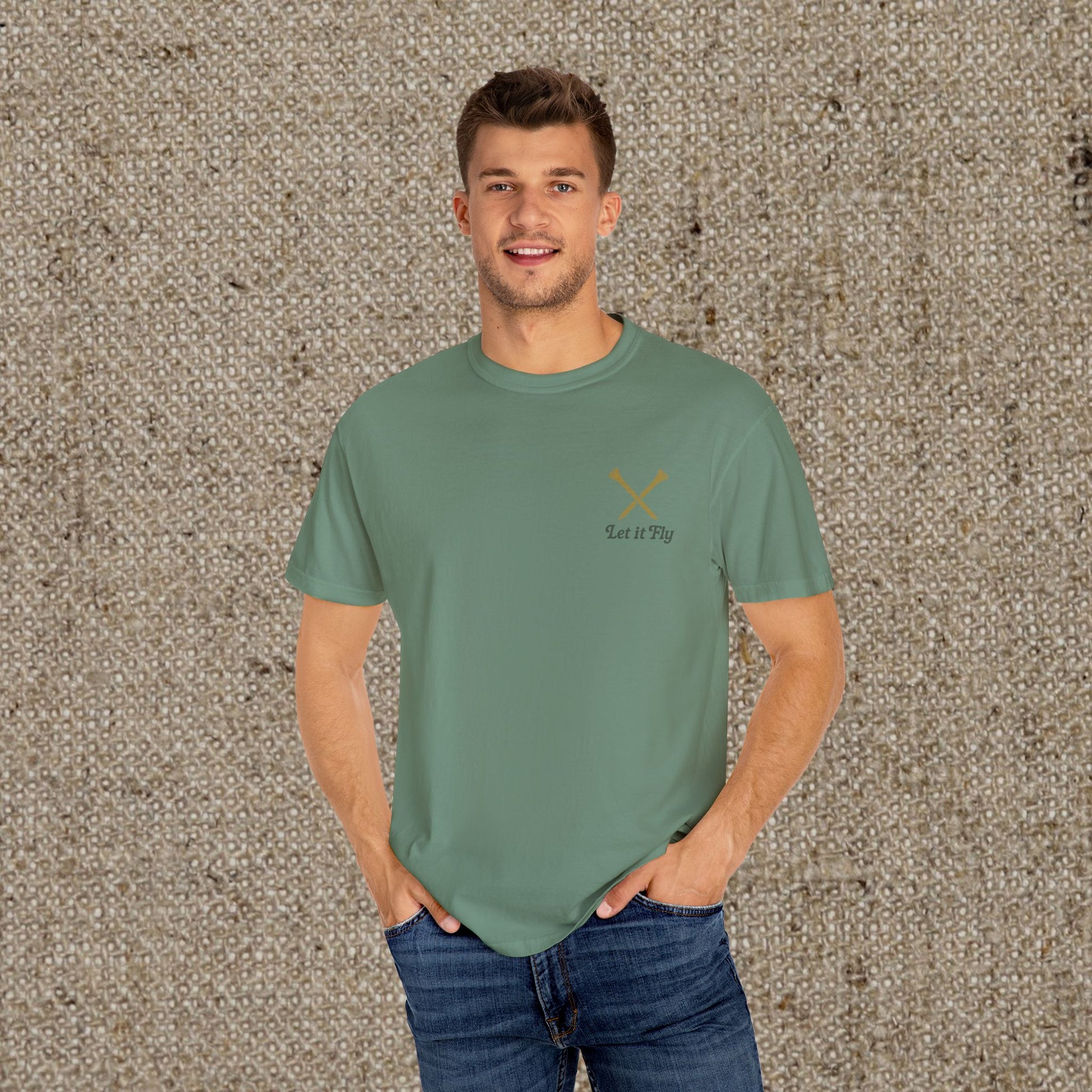 Model wearing the 'Tee It High Let It Fly Graphic Tee', displaying a stylish fit and vibrant color, perfect for golf enthusiasts.