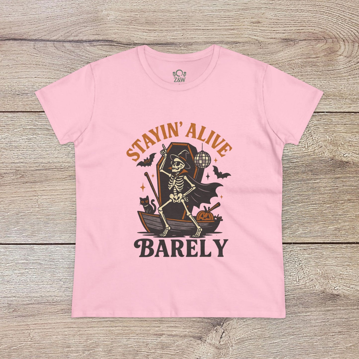 Stayin’ Alive T-Shirt in soft pink with a fun skeleton graphic, an excellent pick for Halloween outings. Comfortable unisex softstyle top for casual wear.