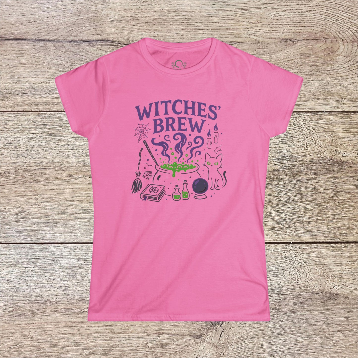 Witches' Brew Halloween T-Shirt in bright pink, featuring a fun design with a cauldron, potion bottles, and a playful cat, created from eco-friendly cotton for durability.