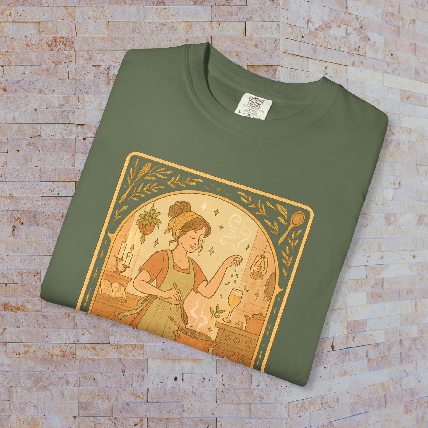 Culinary Queen Tarot Tee in olive green, showcasing a unique design of a woman in a kitchen setting, perfect for cooking enthusiasts. Available in sizes S to 4XL, made from soft pre-shrunk cotton for comfort.