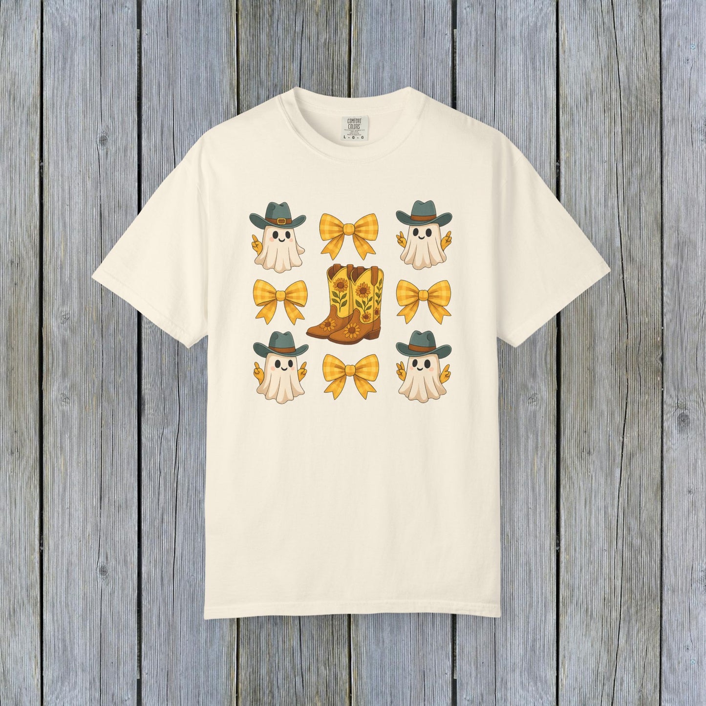 Cute Halloween T-Shirt featuring ghosts in cowboy hats and cowboy boots with yellow bows, unisex fall fashion made of eco-friendly fabric.