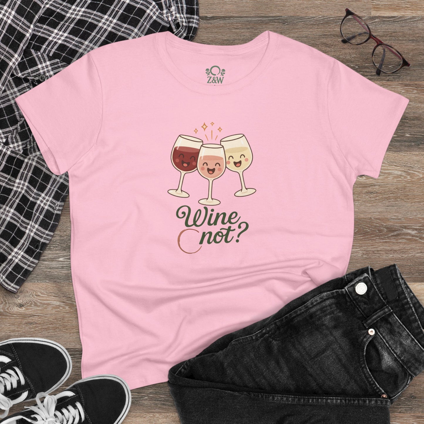 Lifestyle shot of the Wine Not Tee in pink, styled with black jeans and plaid, highlighting the comfortable fit and trendy design.