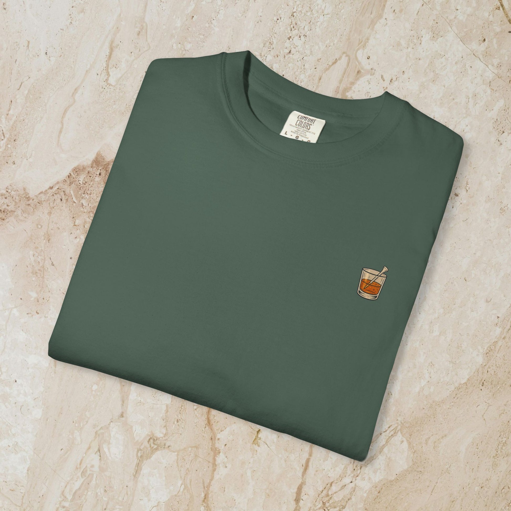 Golden Whiskey Dog Tee - Unique Vintage Style, featuring a whiskey glass pocket design on a green 100% cotton tee, combining comfort and style.
