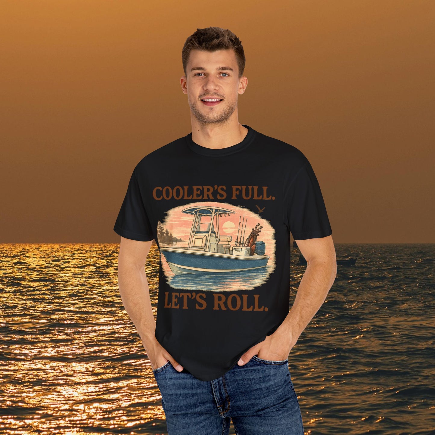 Model showcasing Men's & Women's Durable Cotton Full Tee with 'Cooler's Full. Let's Roll' print against a scenic ocean view.