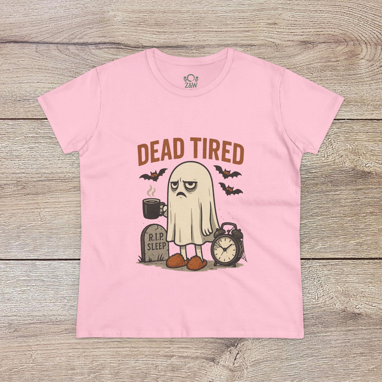 Cute Whimsical Ghost T-Shirt for Halloween in soft pink, featuring a charming 'DEAD TIRED' graphic that includes a ghost and a clock, made of 100% cotton for ultimate comfort.