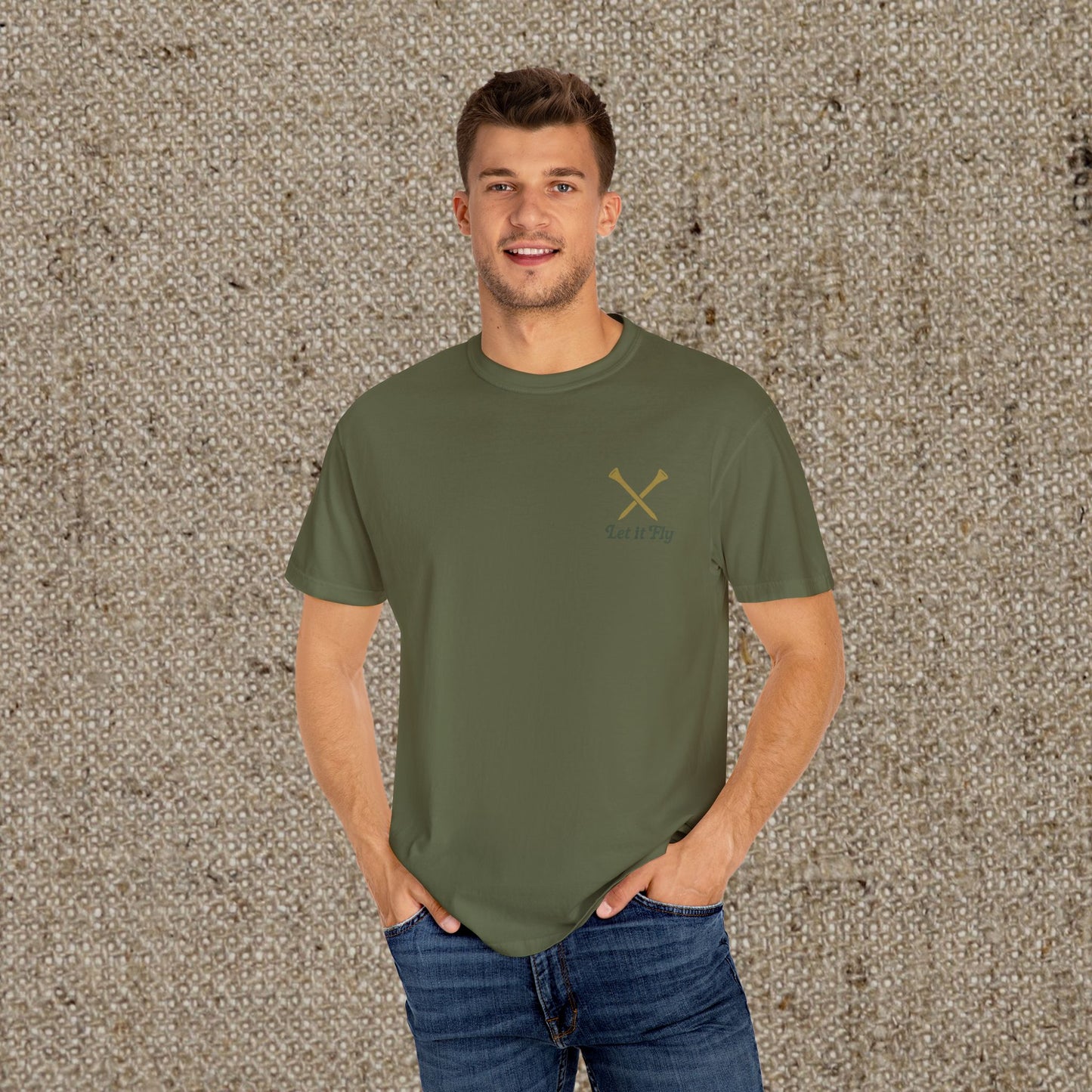 Male model wearing Tee It High Let It Fly Graphic Tee in olive green, demonstrating a stylish and comfortable look for any occasion.