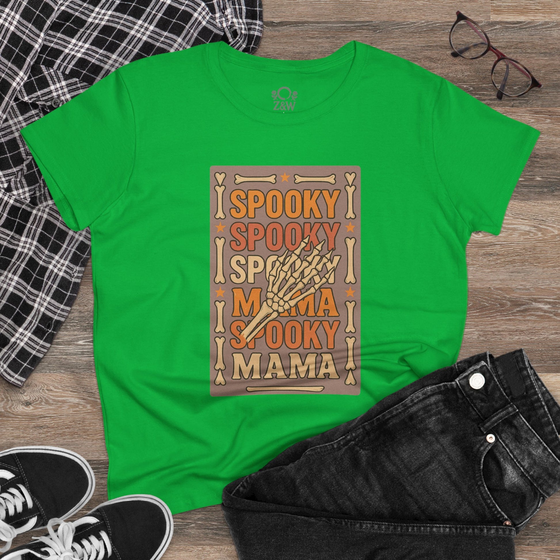 Spooky Mama Tee in vibrant green color featuring a fun spooky design, perfect for Halloween or casual outings, made from soft cotton with a classic fit.