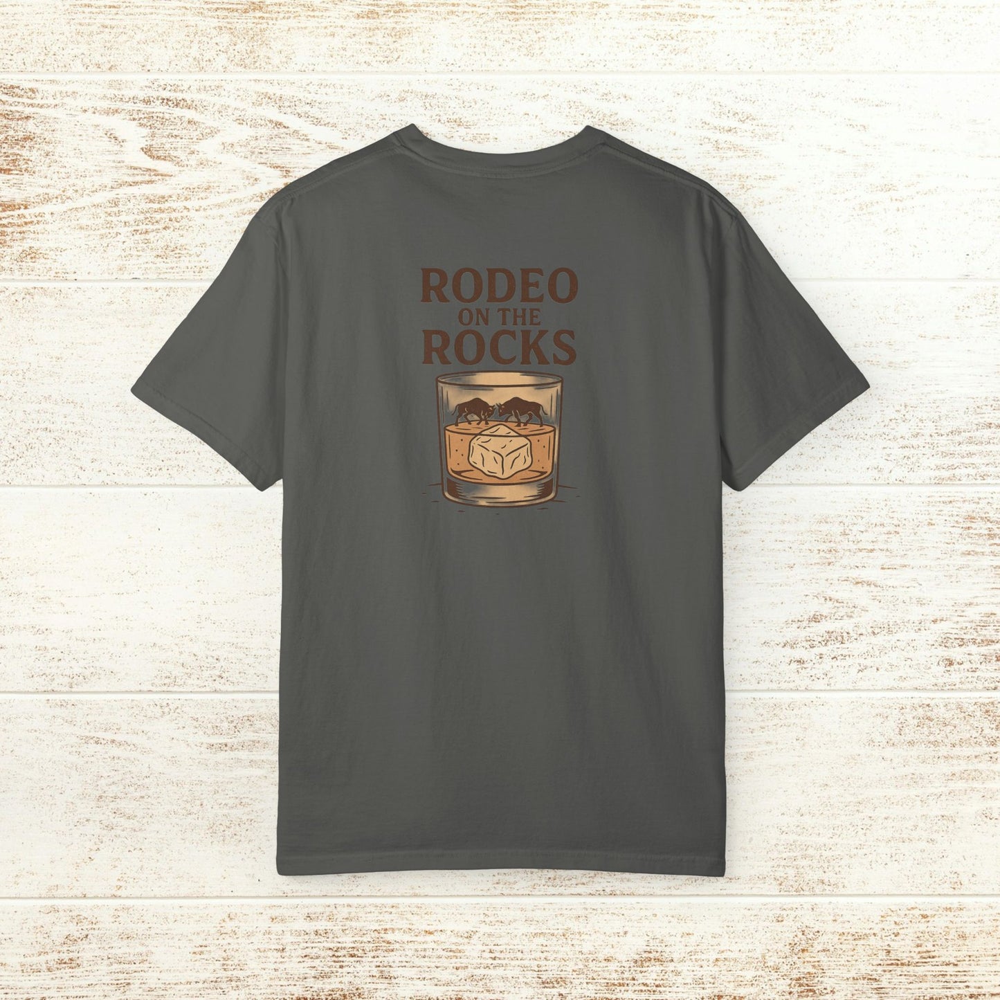 Back view of the Rodeo On The Rocks Tee featuring a stylish graphic design with 'RODEO ON THE ROCKS' text, perfect for showcasing your unique style.
