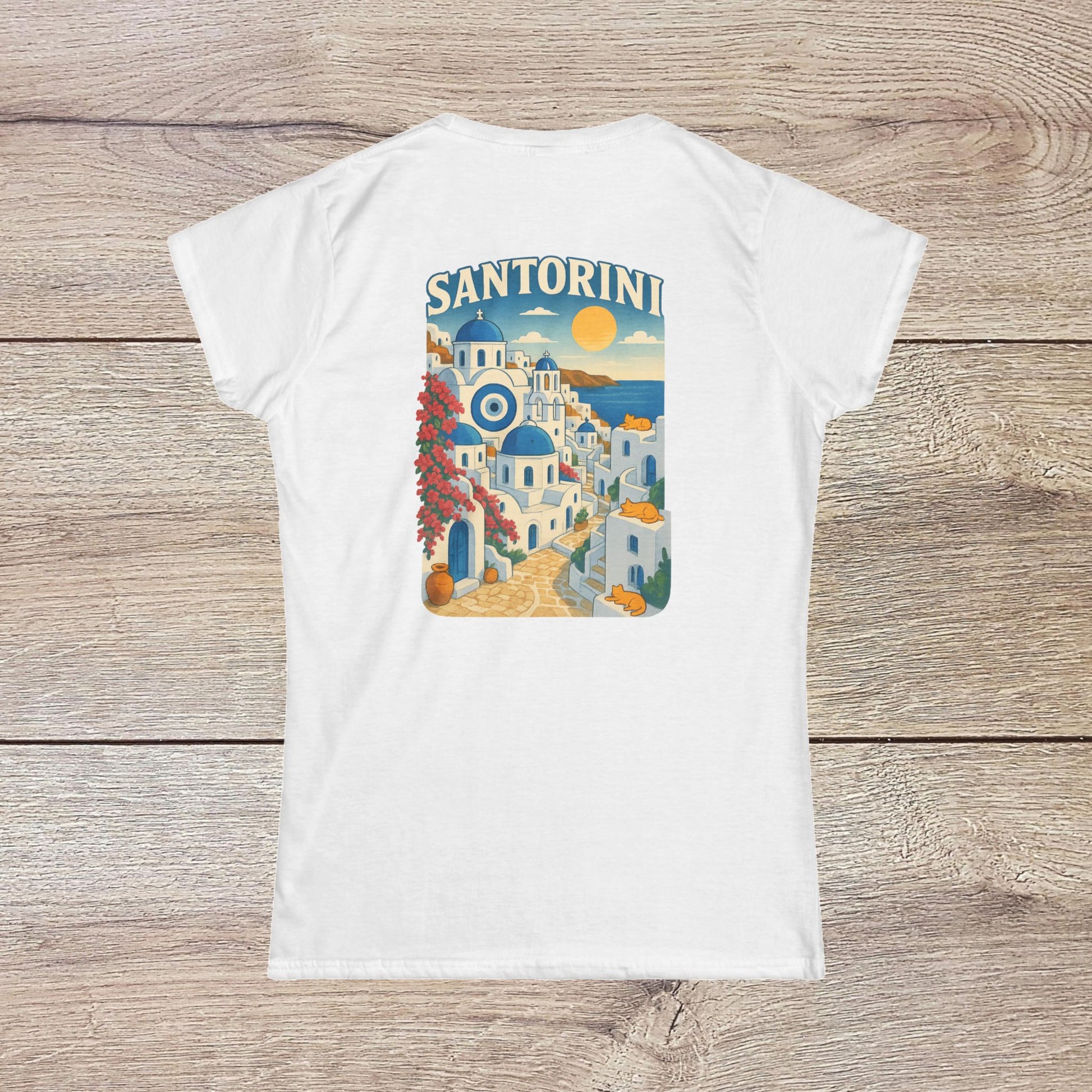 Back view of the Santorini Tee in white, displaying a vibrant graphic of Santorini's architecture and sunset, made from eco-friendly materials.