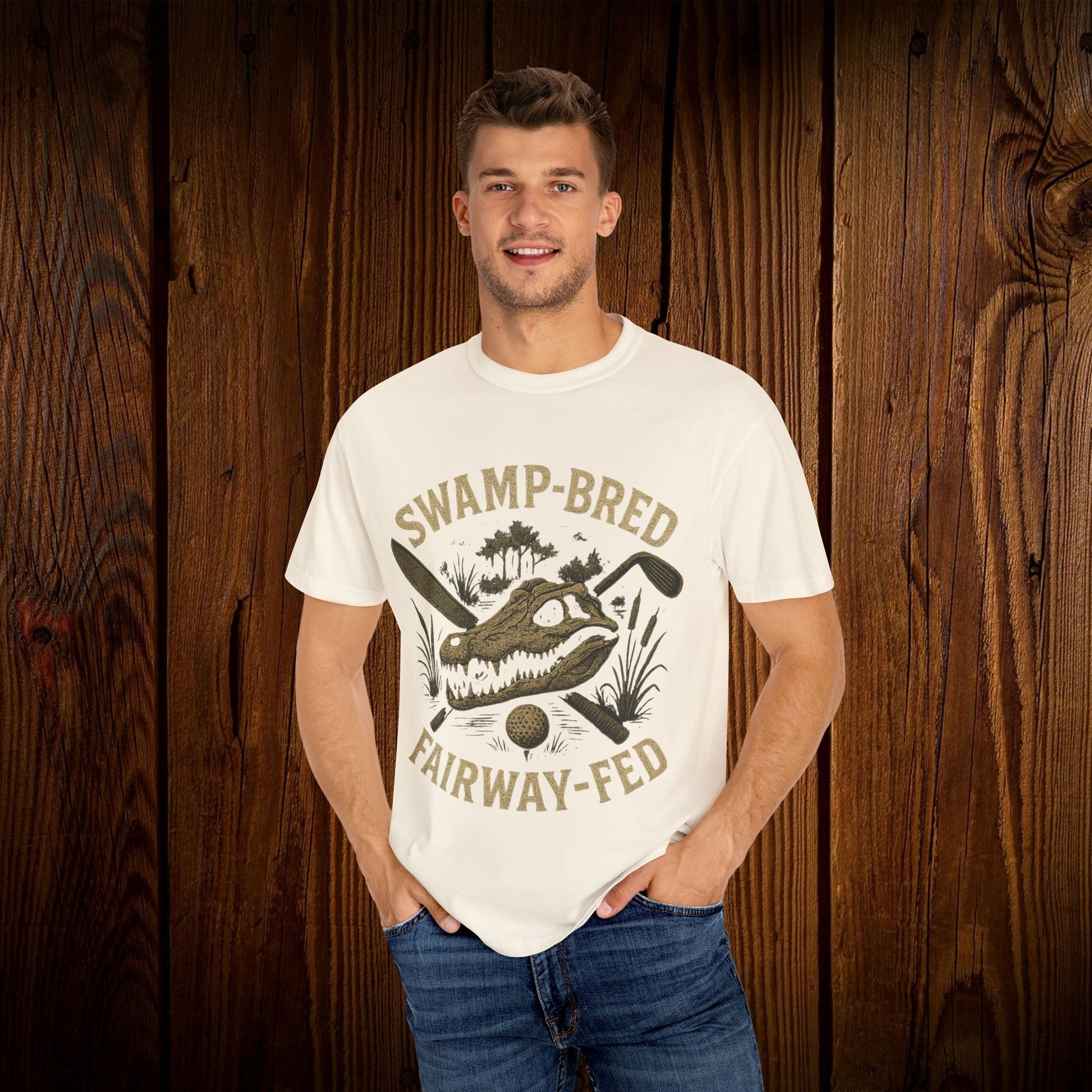 Unisex Swamp-Bred Fairway-Fed Tee displayed on a model, showcasing a stylish design made of 100% pre-shrunk US cotton, highlighting its comfortable fit and durable double-needle stitching.