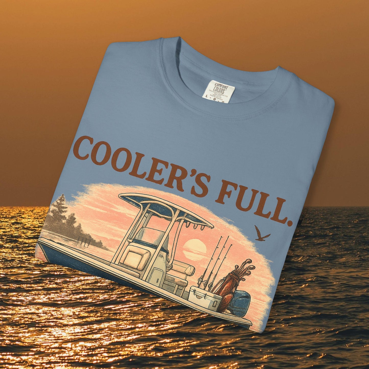 Men's & Women's Durable Cotton Full Tee displayed on water with a graphic of a boat and the slogan 'COOLER'S FULL.' Ideal for outdoor activities.