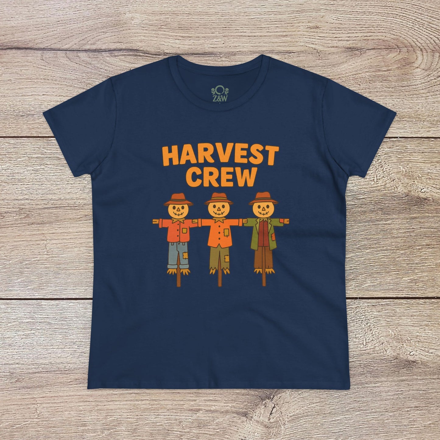 Harvest Crew Halloween T-Shirt in navy blue featuring cheerful scarecrow characters with the text 'Harvest Crew'. Made from soft 100% ring-spun cotton, it offers a classic fit and eco-friendly style.