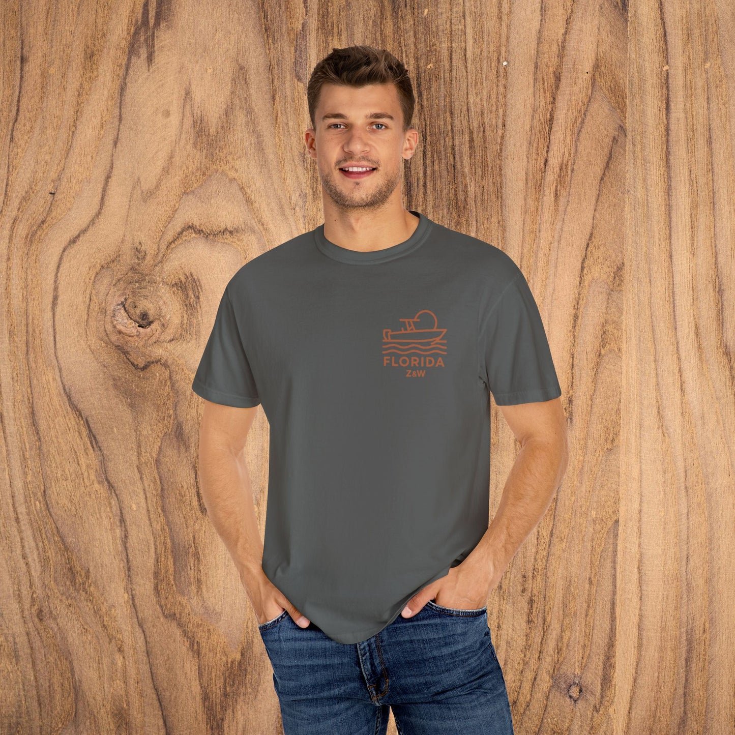 Unisex Florida Graphic Tee worn by a model in gray, showcasing a chic boat design, ideal for versatile casual wear.