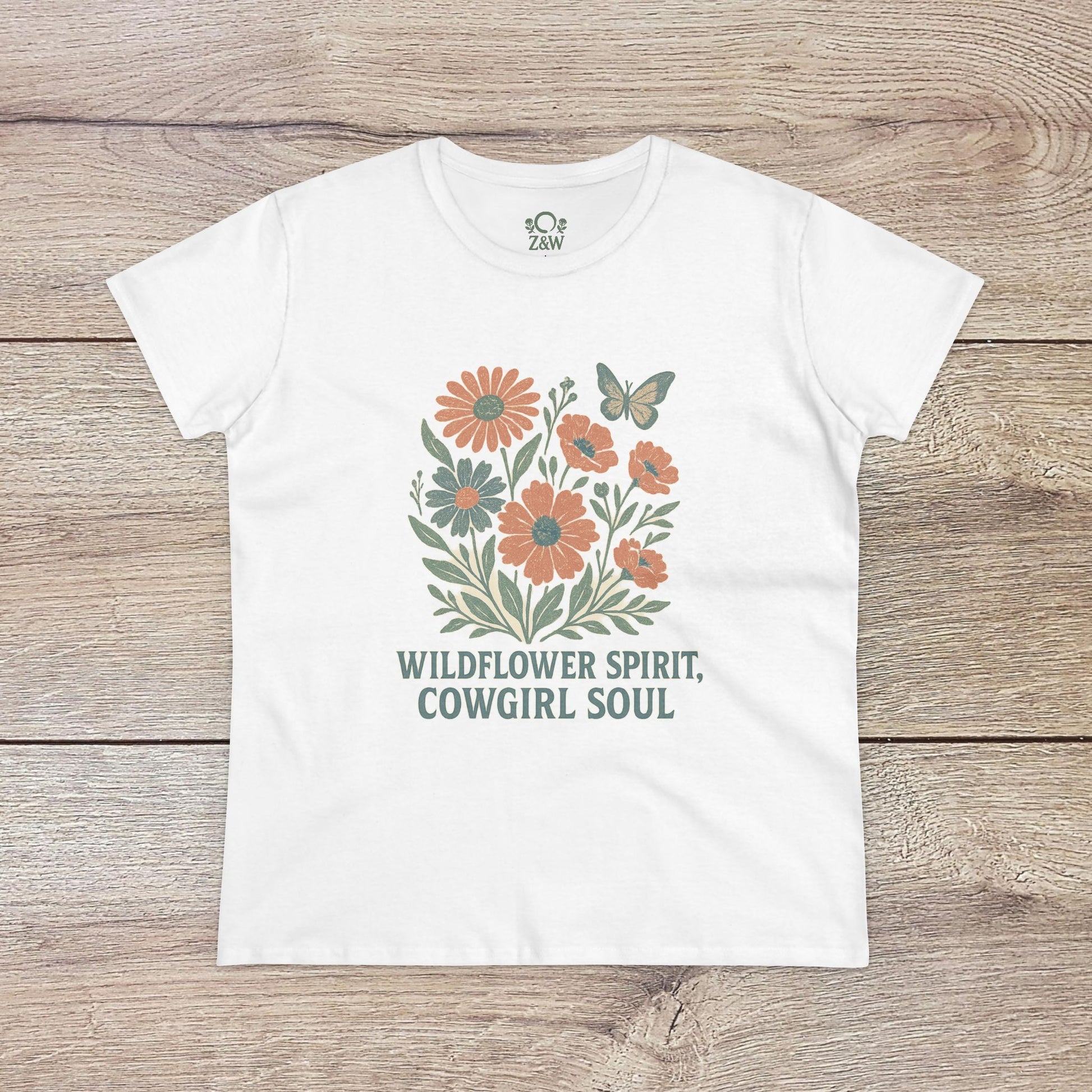 Wildflower Spirit Cotton Tee in white showcasing an intricate floral illustration with the text 'Wildflower Spirit, Cowgirl Soul', perfect for casual wear.