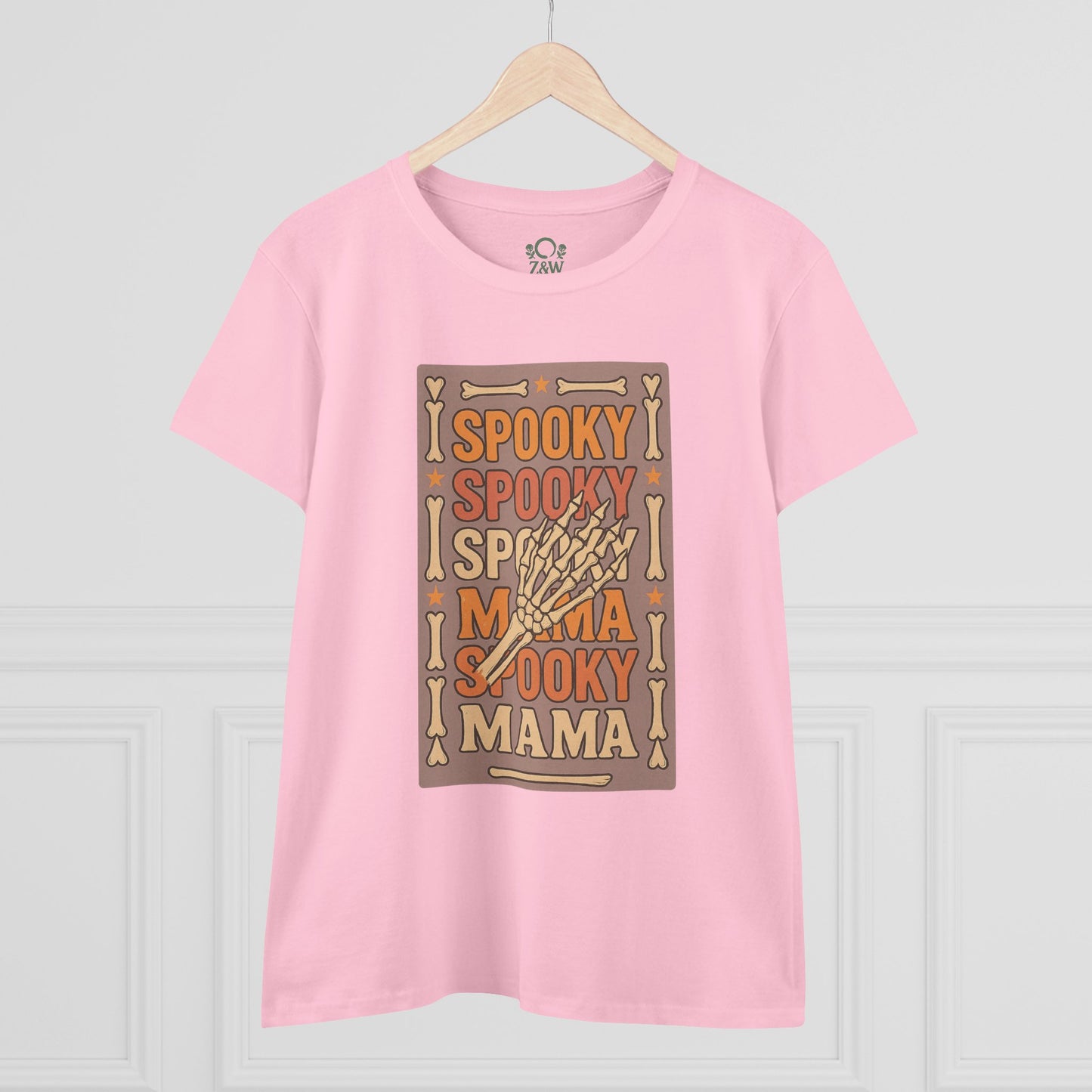 Spooky Mama Tee in pink featuring a fun skeleton hand graphic, designed for a classic fit; ideal for Halloween or casual wear.