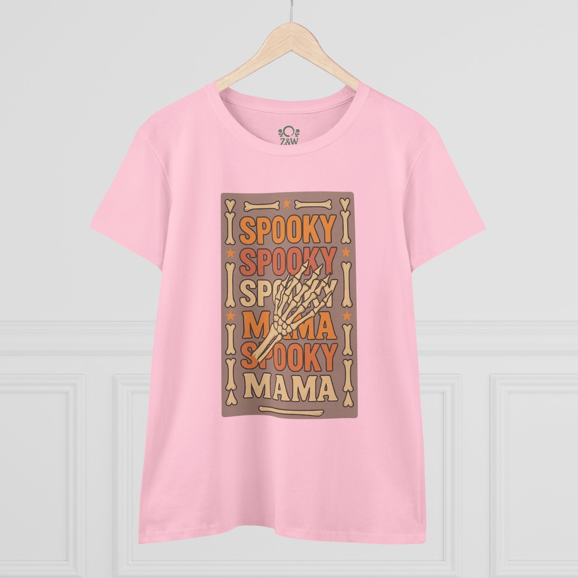 Spooky Mama Tee in pink featuring a fun skeleton hand graphic, designed for a classic fit; ideal for Halloween or casual wear.