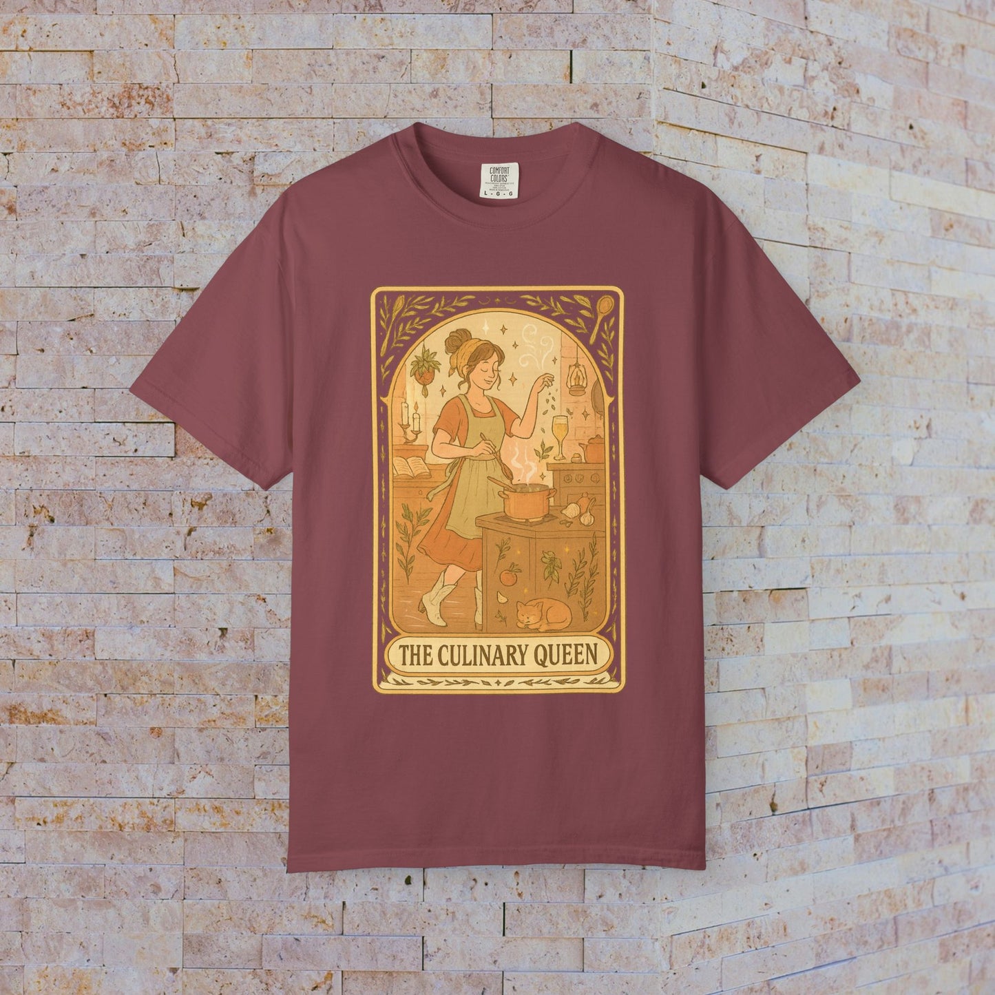 Culinary Queen Tarot Tee in maroon, featuring an enchanting illustration of a queen cooking with a goose, available in sizes S to 4XL, made from soft, pre-shrunk cotton.
