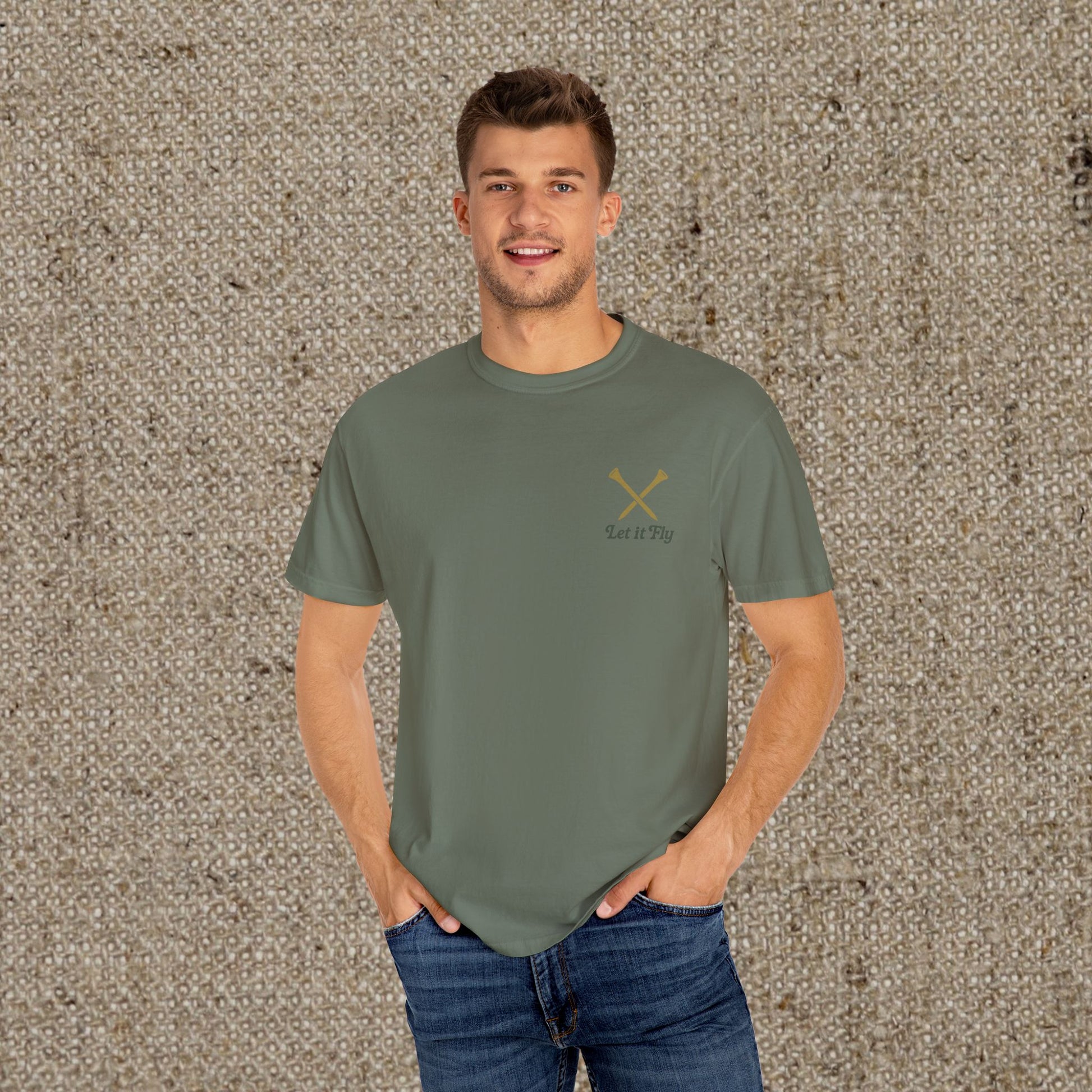 Casual model wearing the Tee It High Let It Fly Graphic Tee in olive green, showcasing a modern look with a stylish design, perfect for everyday wear.