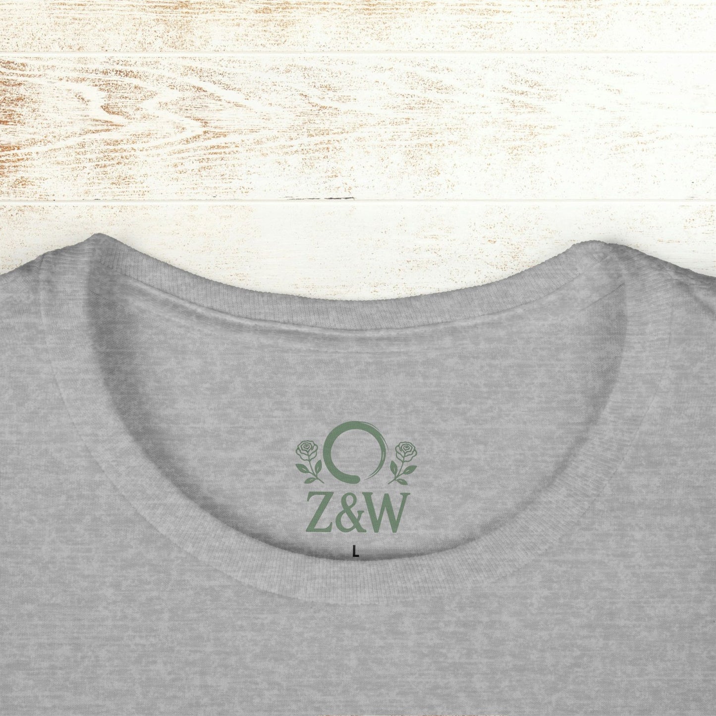No Bad Vibes Tee - Close-up of the neckline on a grey t-shirt with a ribbed collar and logo, promoting sustainability and comfort.