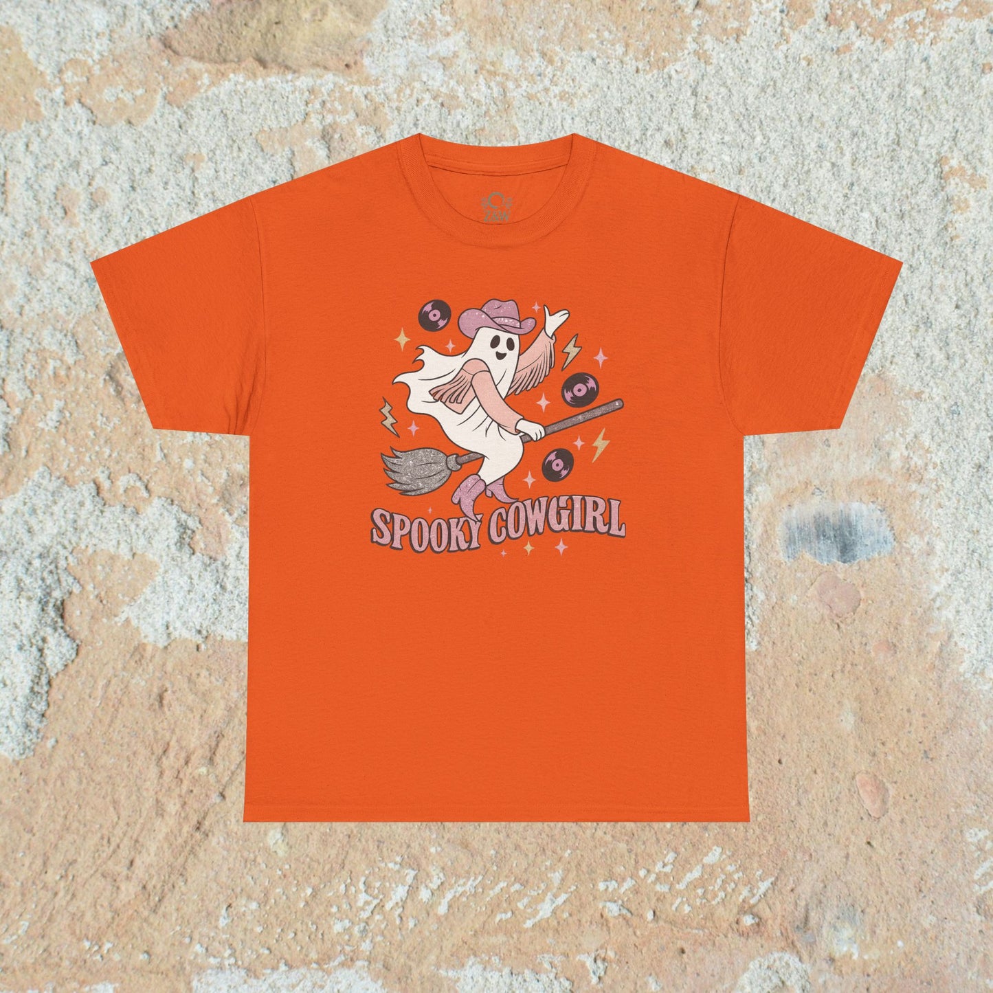 Vibrant orange Spooky Cowgirl Graphic Tee featuring a cute ghost cowgirl, perfect for adding a pop of color to your Halloween wardrobe.