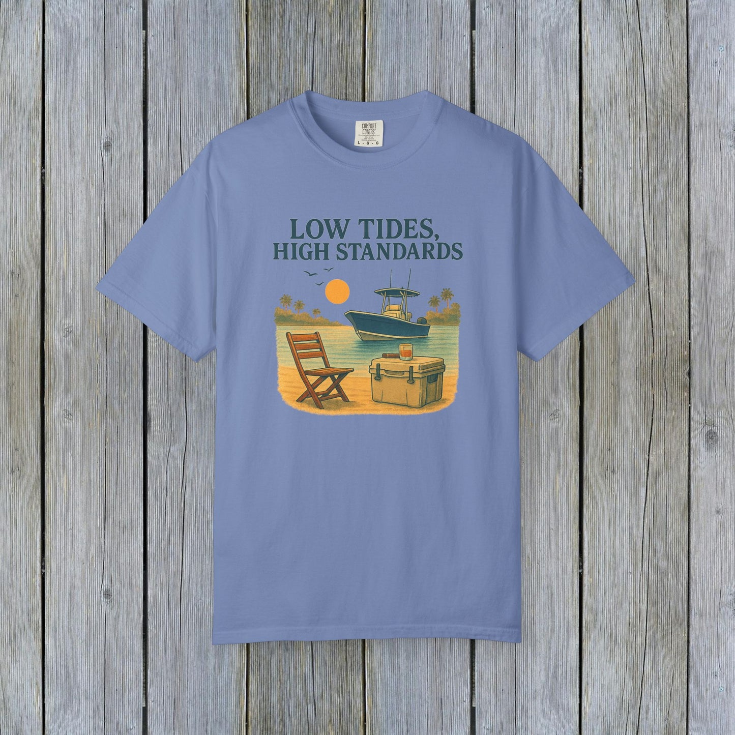 Garment-Dyed Low Tides High Standards T-Shirt in soft blue color, featuring a beach scene with a boat, ideal for casual wear.