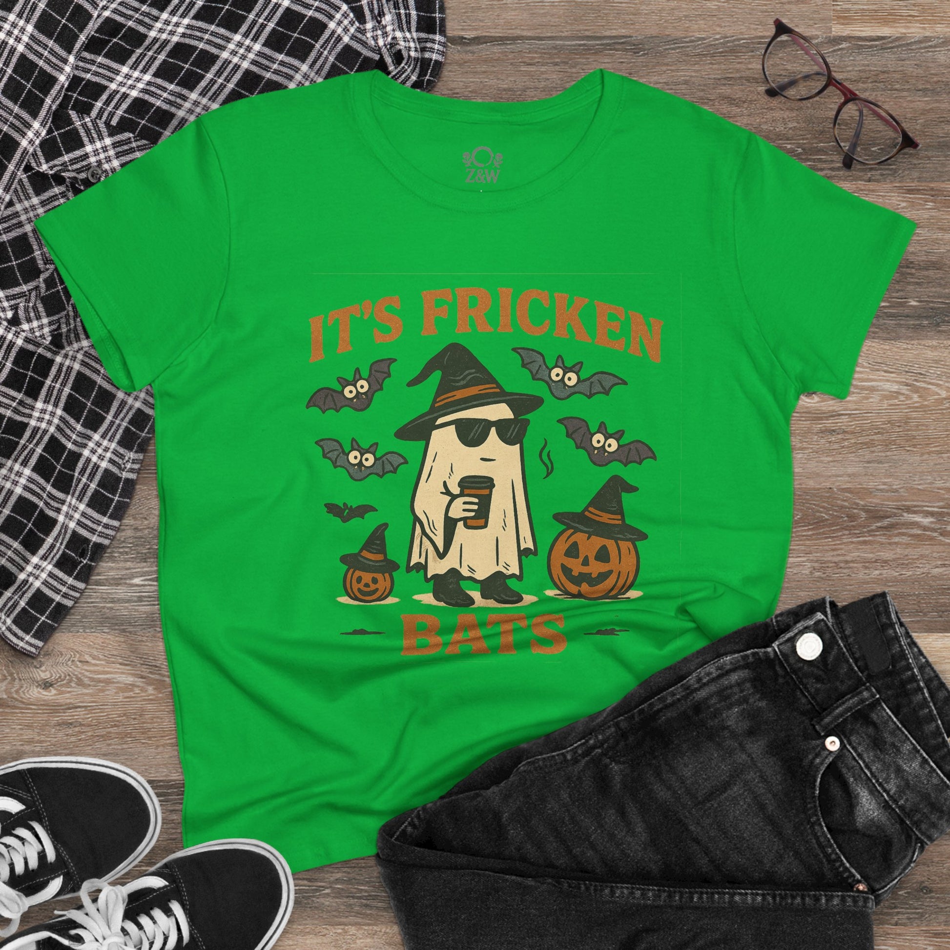 Halloween Unisex T-Shirt featuring a fun graphic of a ghost with sunglasses, bats, and pumpkins. Made from 100% cotton, perfect for trick-or-treating.