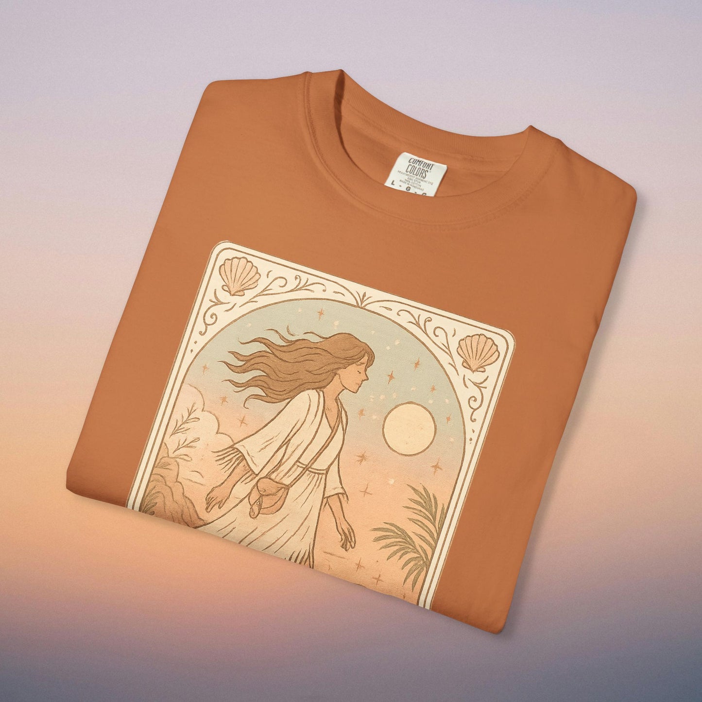 Wanderer Tarot Graphic Tee in warm terracotta, featuring a stunning artistic representation of a woman with a mystical backdrop. This uniquely styled tee is ethically made with 100% cotton and available in sizes S to 4XL.