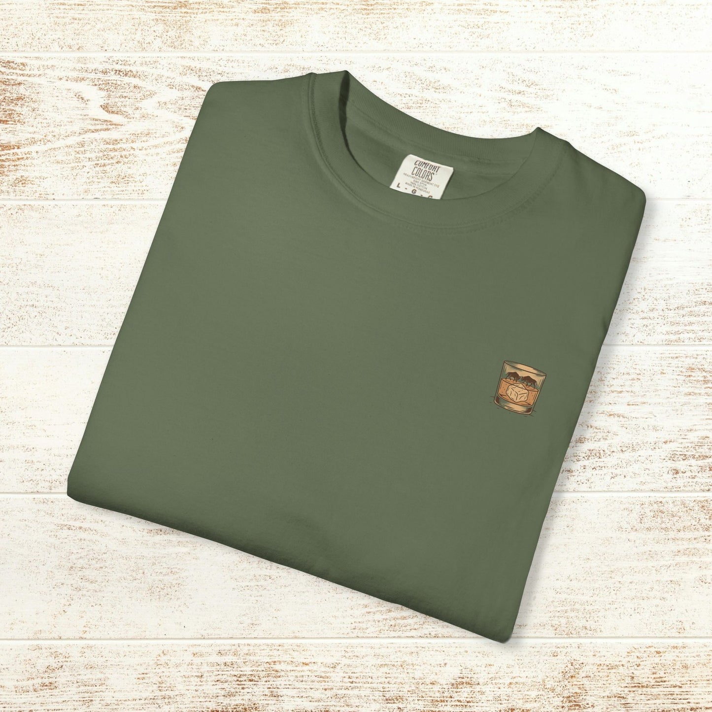 Rodeo On The Rocks Tee displayed flat in a stylish green color, made from soft garment-dyed 100% US cotton, perfect for everyday style.