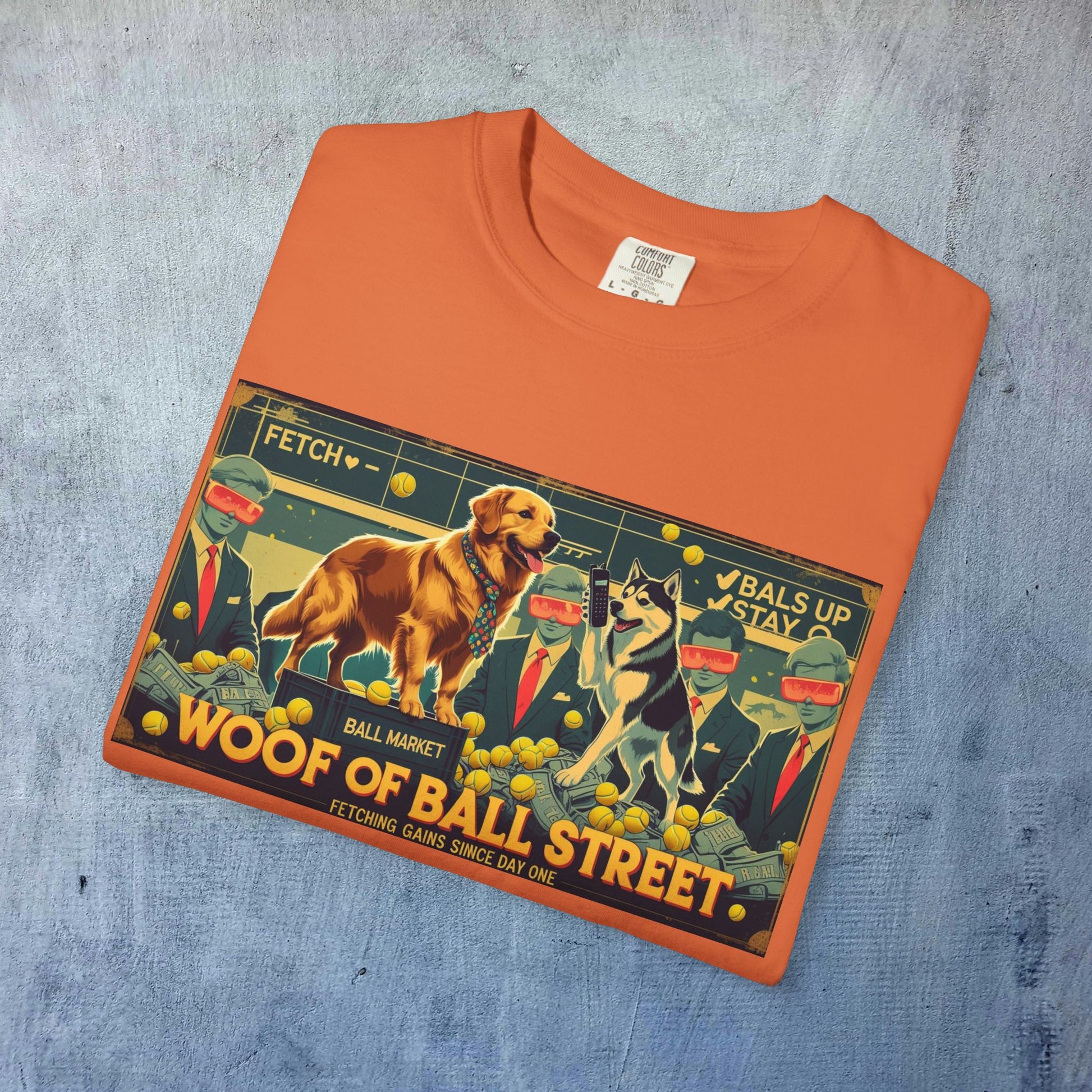 Front view of the Sleek Woof of Ball Street T-Shirt folded, featuring a colorful graphic design with dogs and playful characters, perfect for dog lovers.