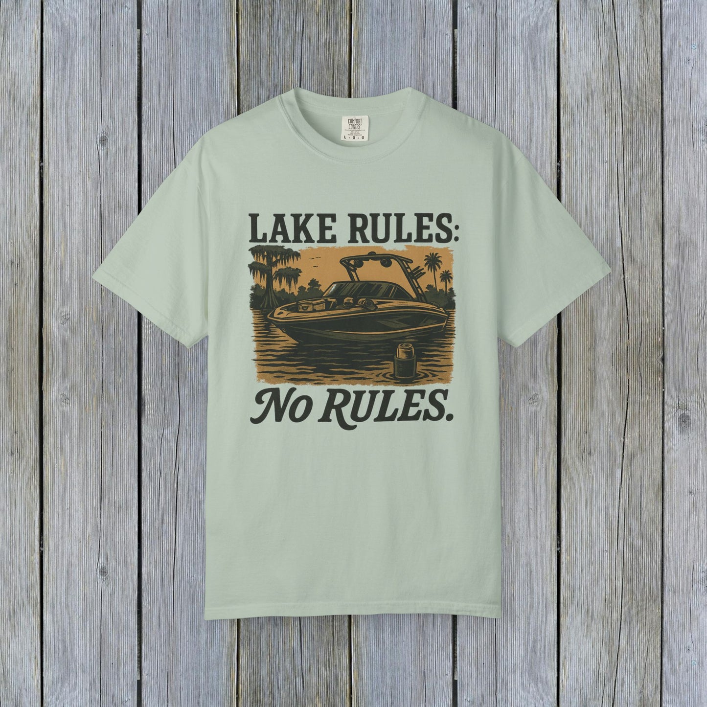 Unisex Garment-Dyed Lake Rules Tee in soft mint green, displaying a lake illustration and the phrase 'Lake Rules: No Rules.', designed for comfort and outdoor adventures.